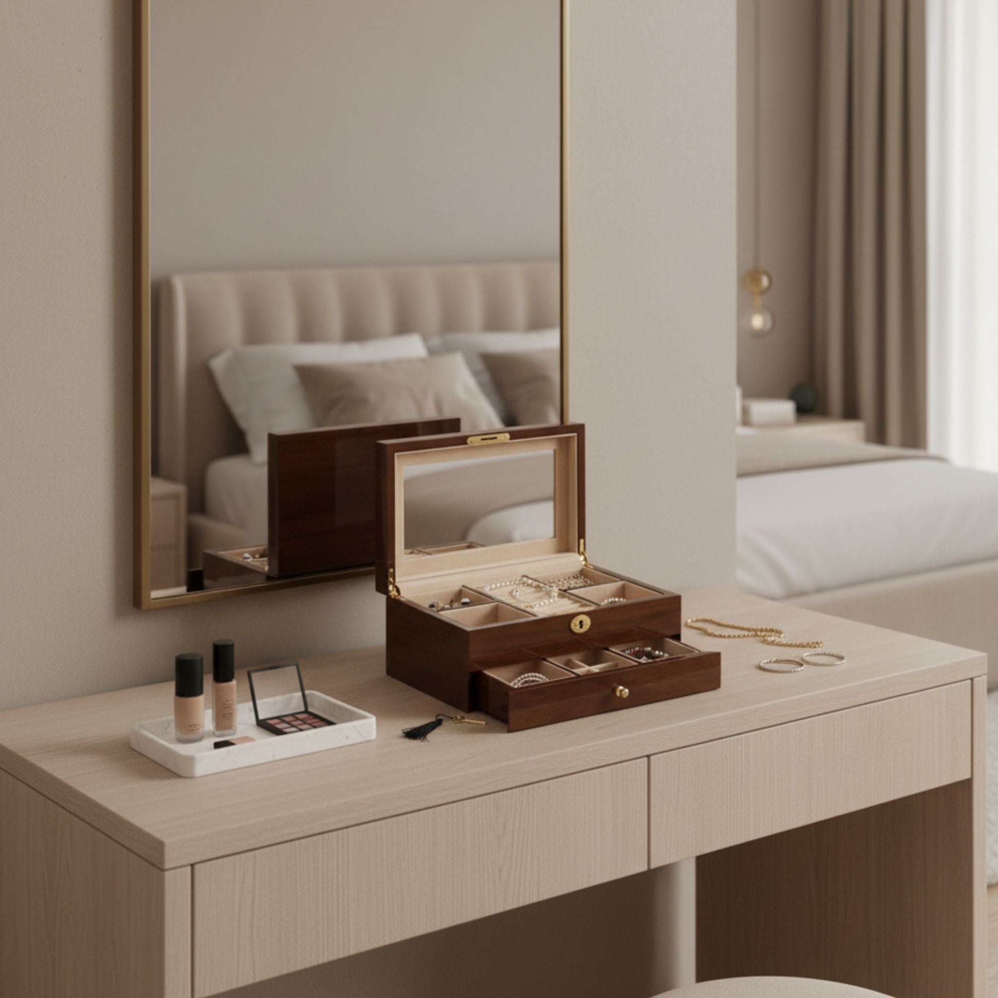 Wooden jewellery box on a vanity table with makeup items, mirror, and bed in the background
