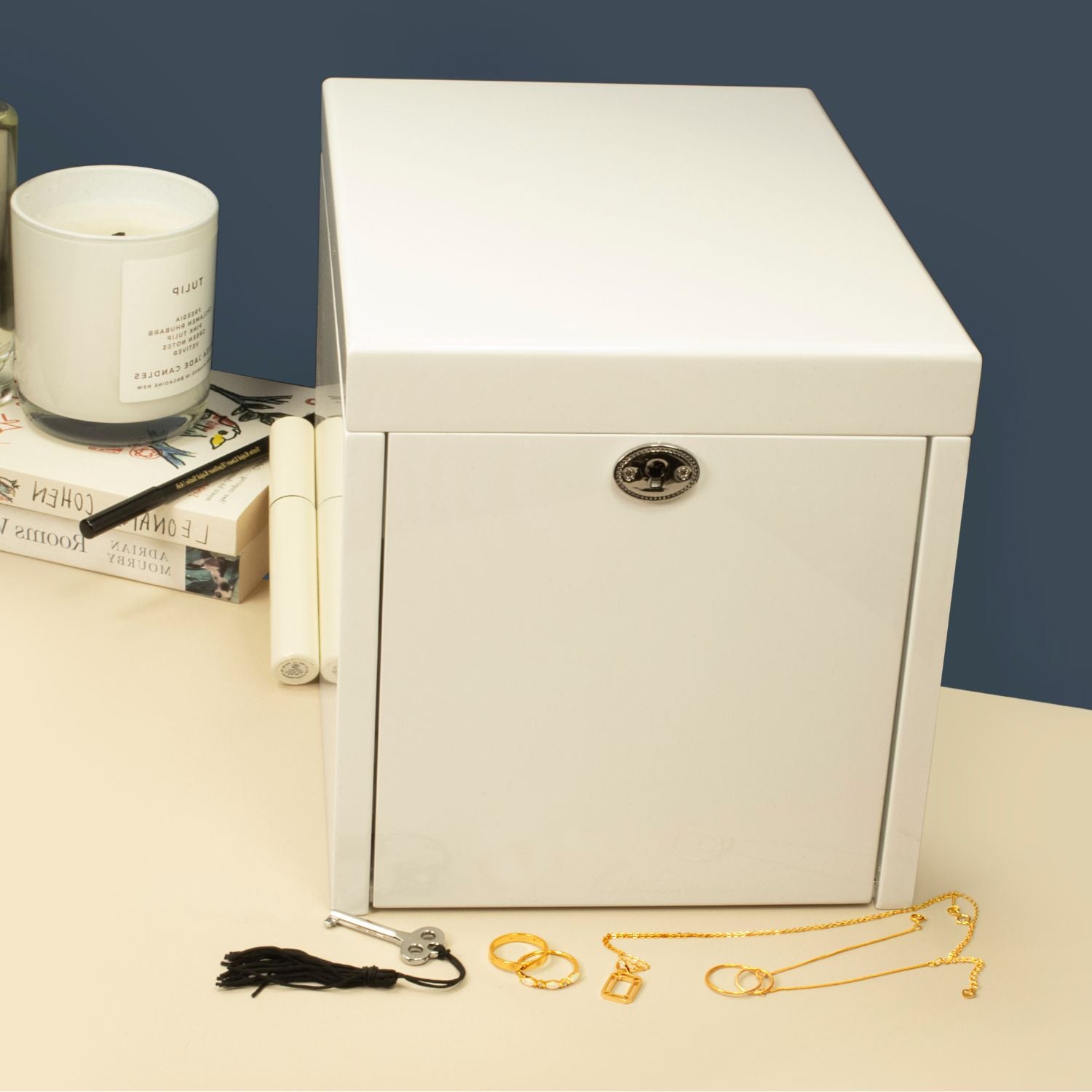 Sleek white gloss jewellery box with three drawers, styled in a lifestyle setting for elegant and organized jewellery storage