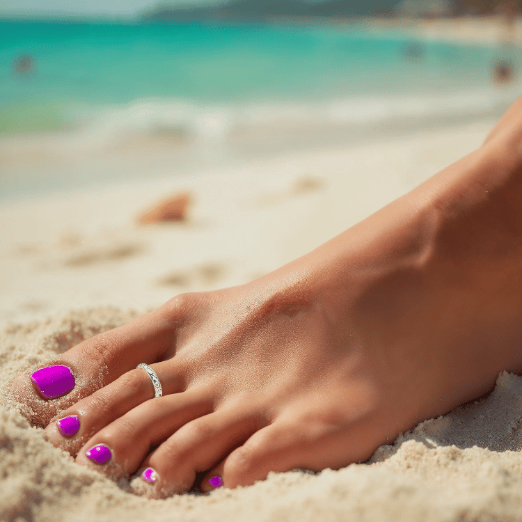 Model wearing Aria toe ring in sterling silver, showcasing its delicate and stylish design for a chic look
