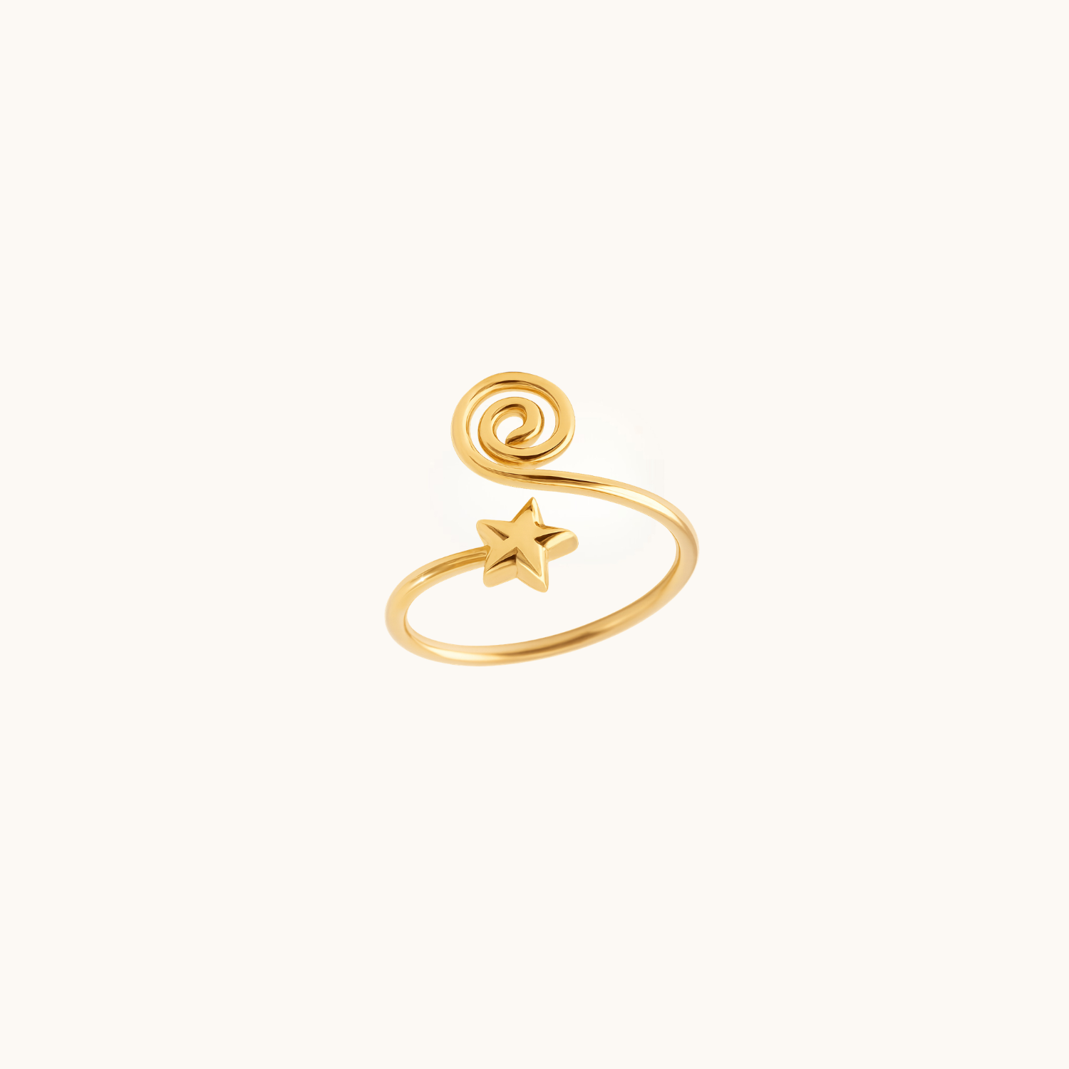 Gold toe ring with star design on a white background
