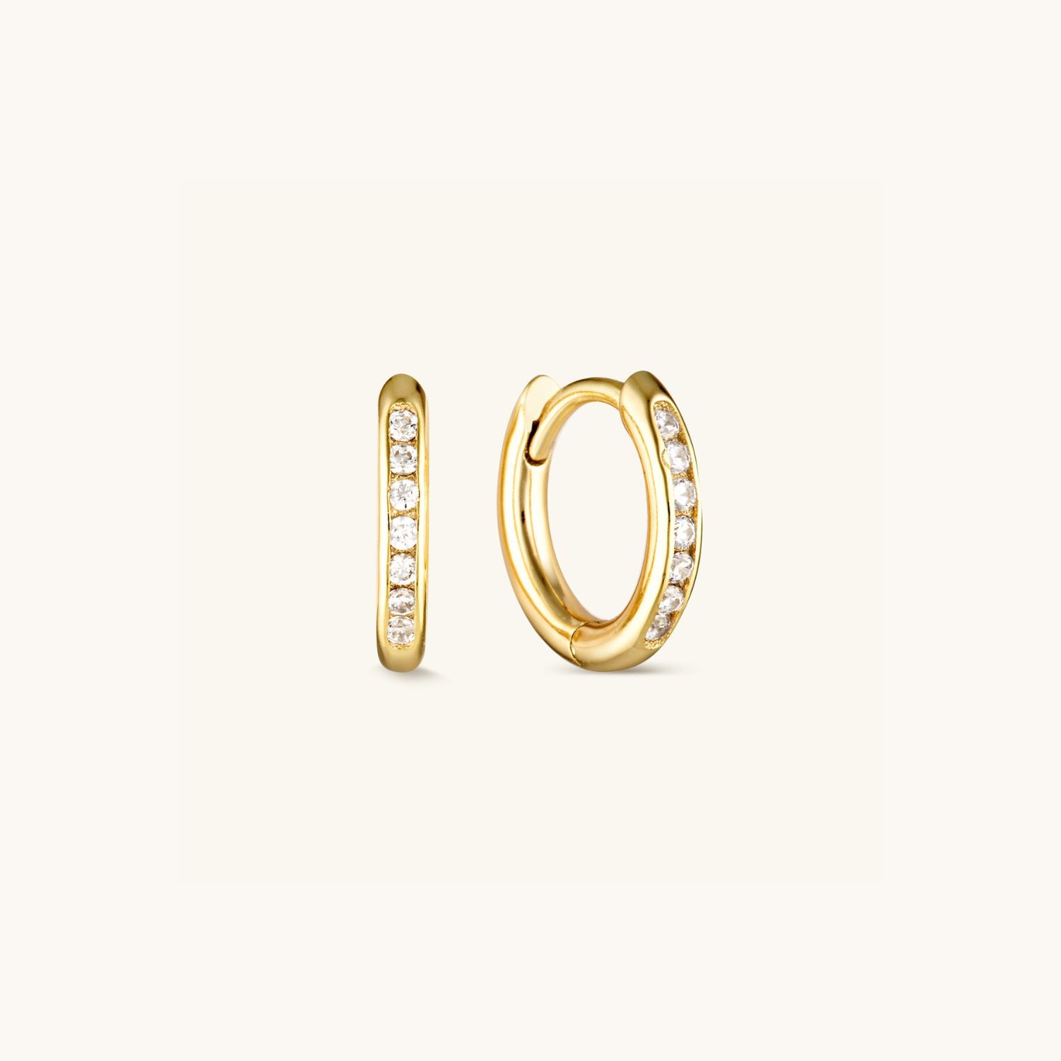 Classic cubic zirconia huggie earrings with a timeless, sparkling design. Perfect for everyday elegance and effortless style