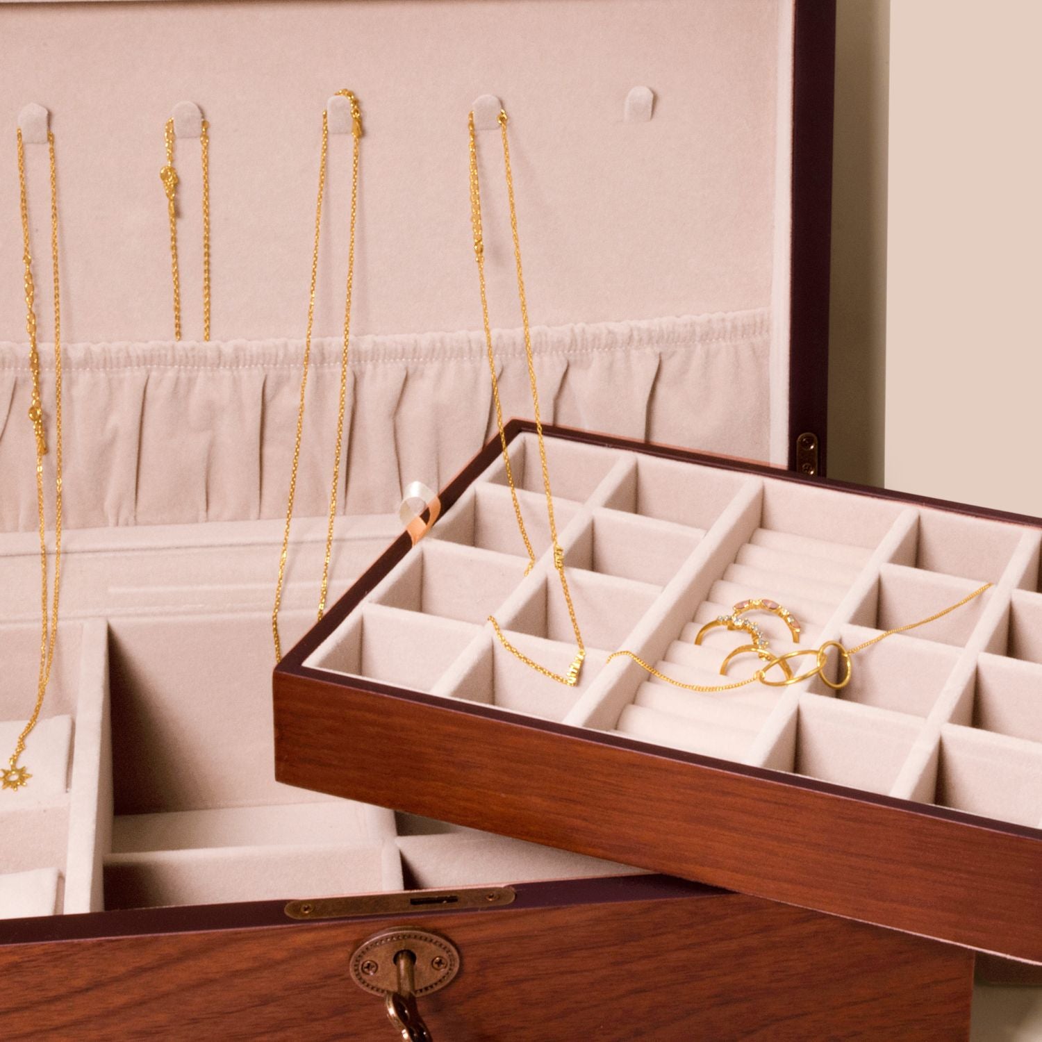 Close-up of walnut matt finish jewellery box with removable tray, highlighting storage compartments and soft velour interior.