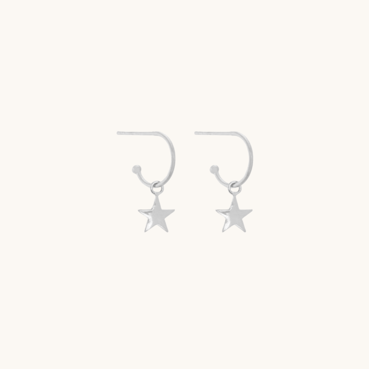 Star drop earrings on a white background