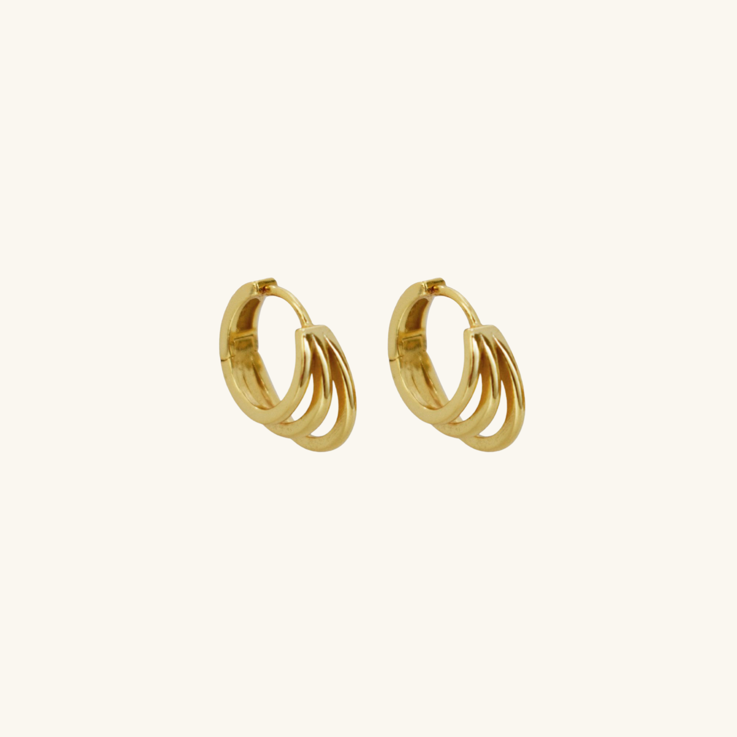Gold hoop earrings on a white background