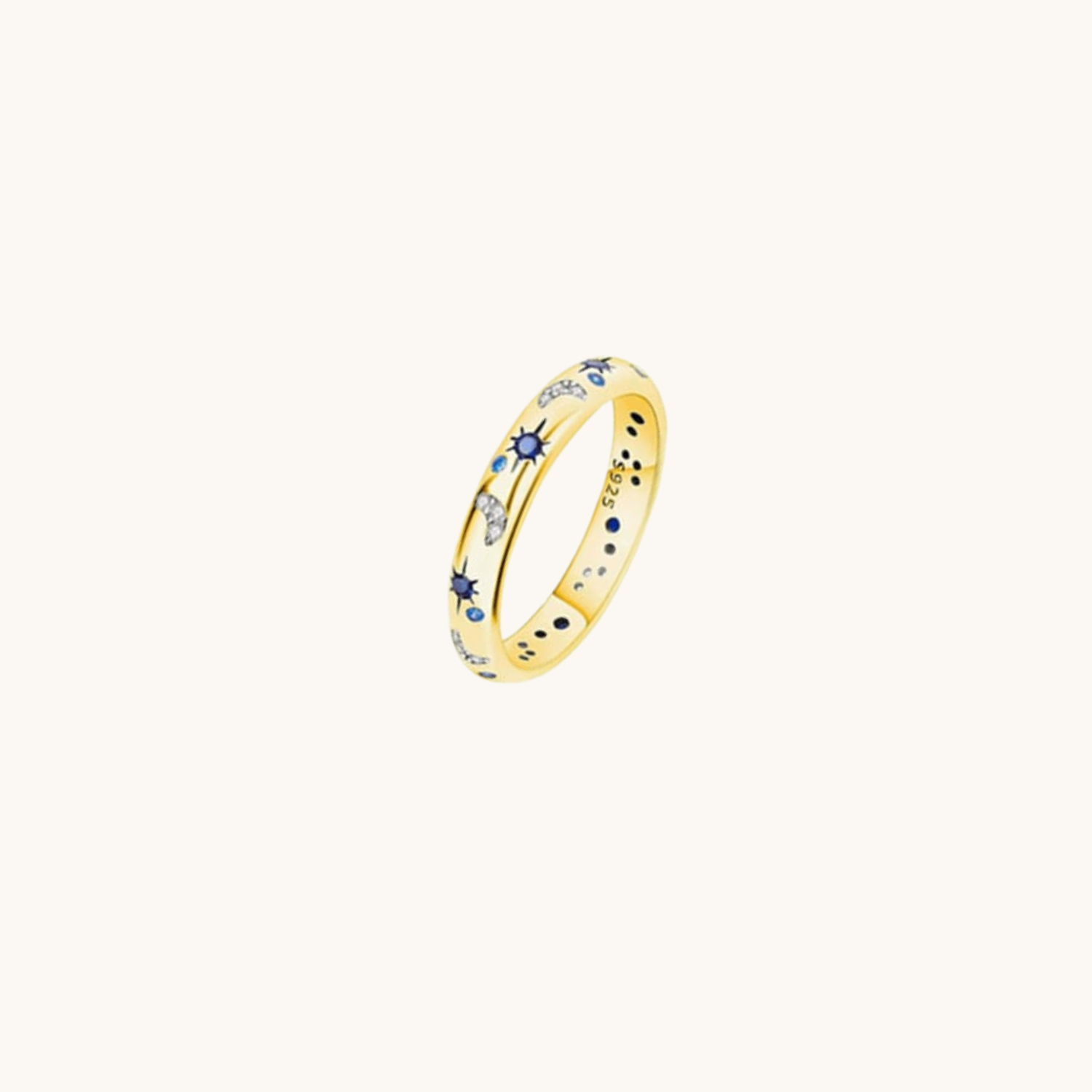 Gold ring with embedded stones on a white background