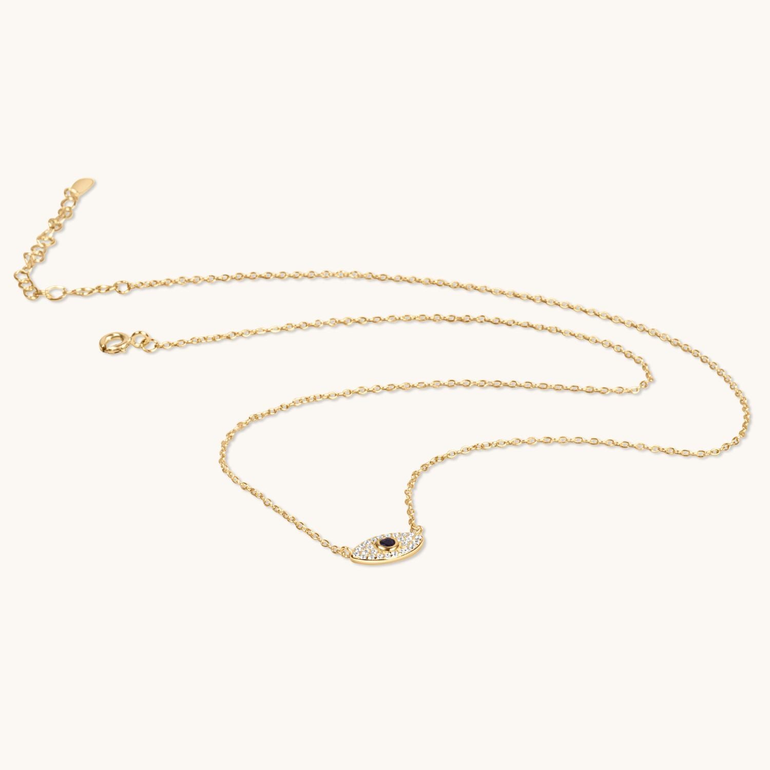 Gold evil eye necklace featuring a polished protective charm on a fine chain, designed for a chic, meaningful, and elegant accessory
