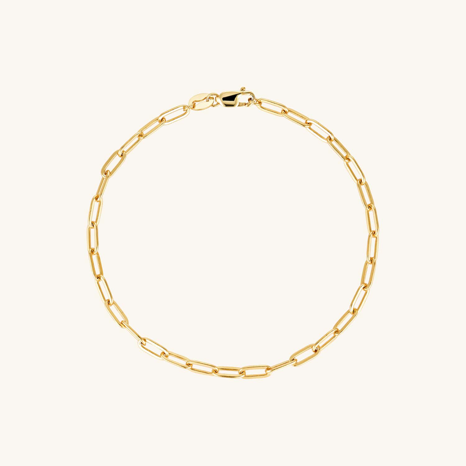 Gold paperclip bracelet with a sleek, modern chain-link design. A versatile statement piece perfect for layering or wearing solo