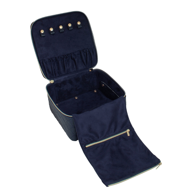 Open navy woven patterned jewellery case displaying multiple storage sections for rings, earrings, and necklaces
