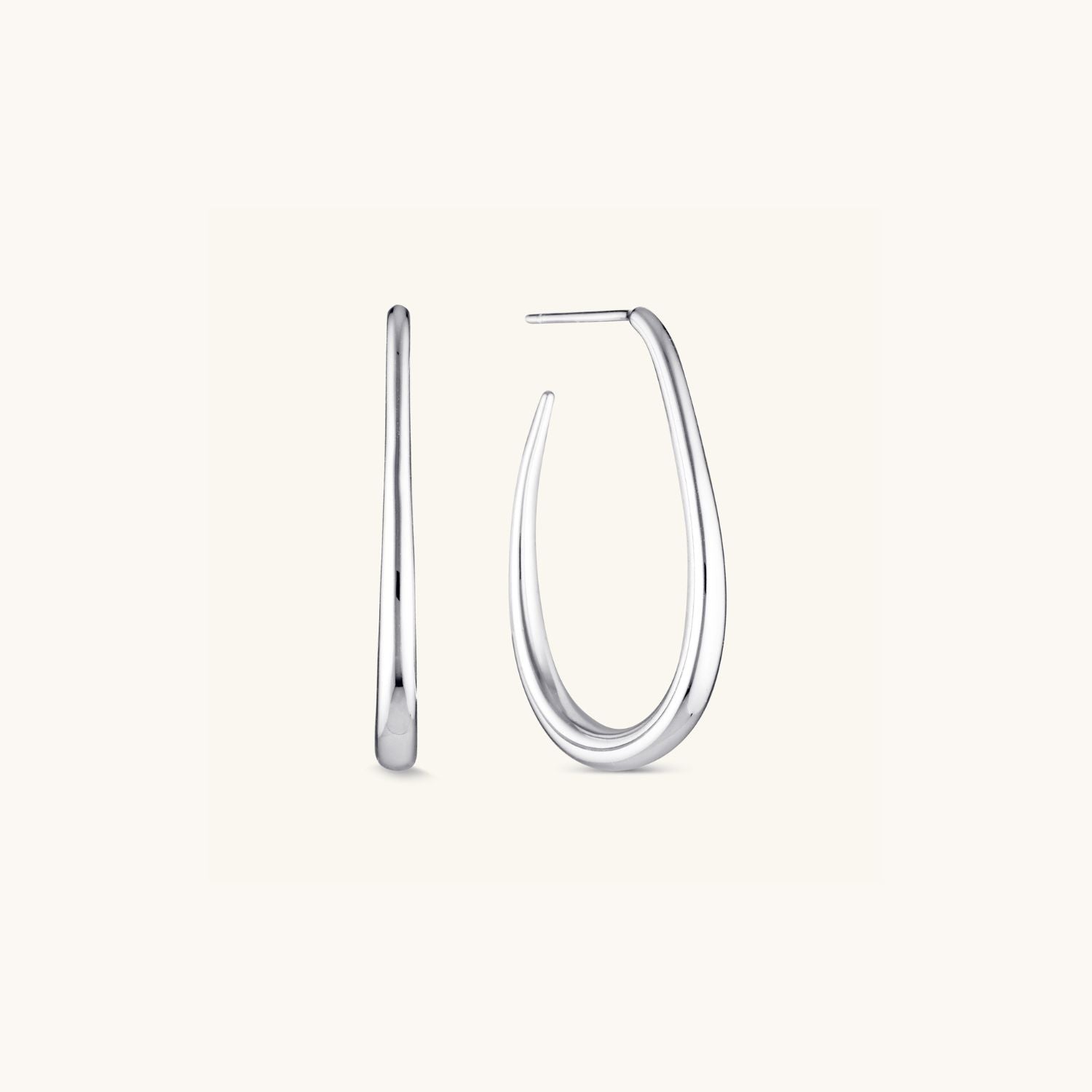 Silver Halo Hoops with a high-shine finish and classic loop design, offering a modern yet timeless look perfect for everyday wear or special occasions