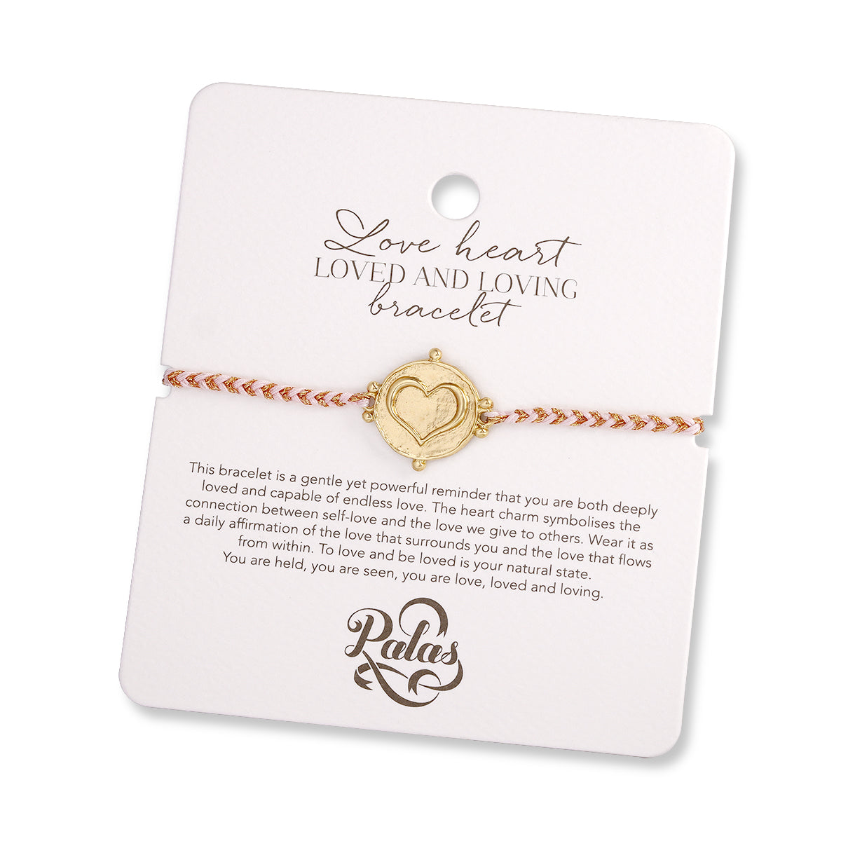 Gold heart-shaped bracelet on a Palas branded card with text