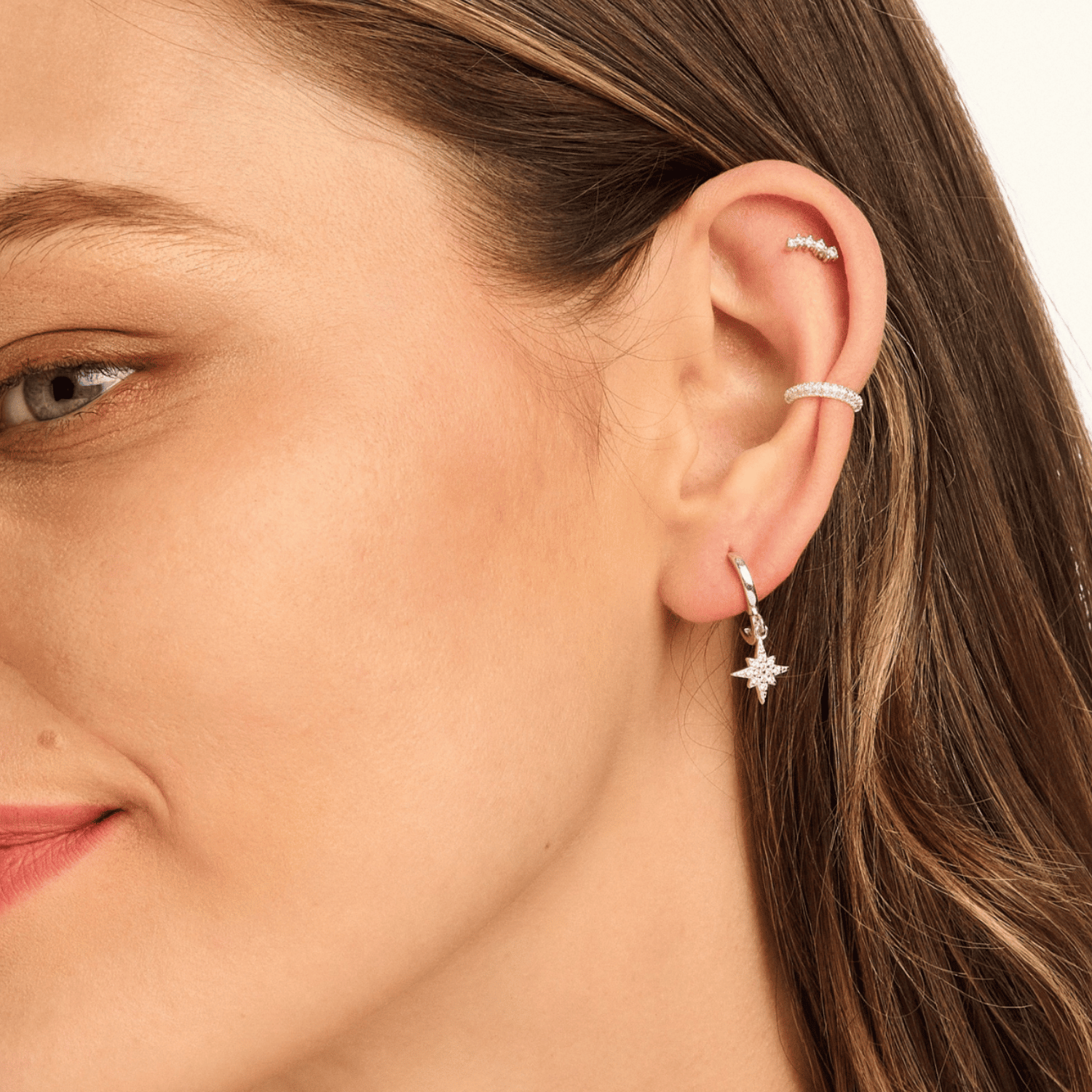 Model wearing sterling silver crystal ear cuff with elegant sparkle.