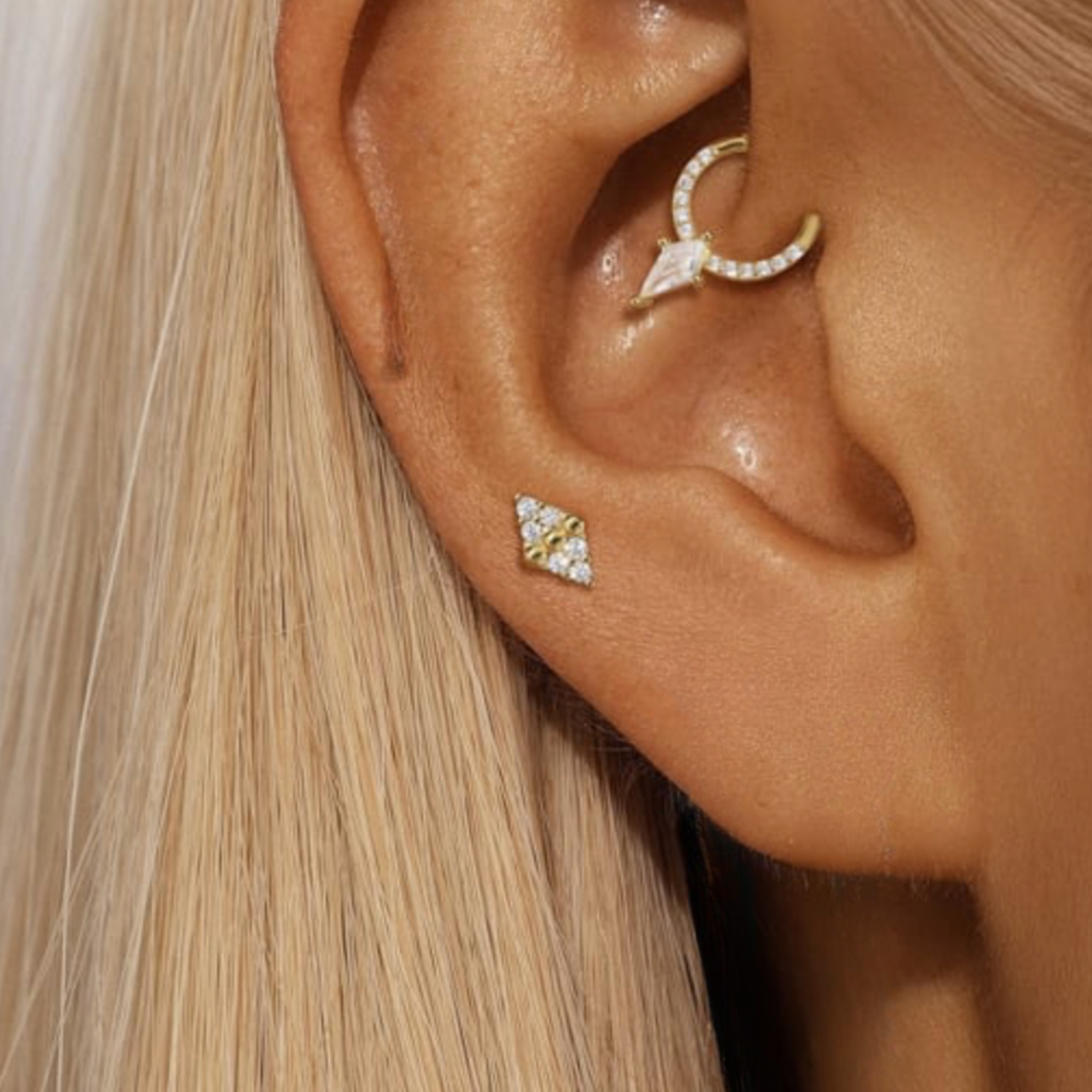 Close-up of an ear wearing kite single earring