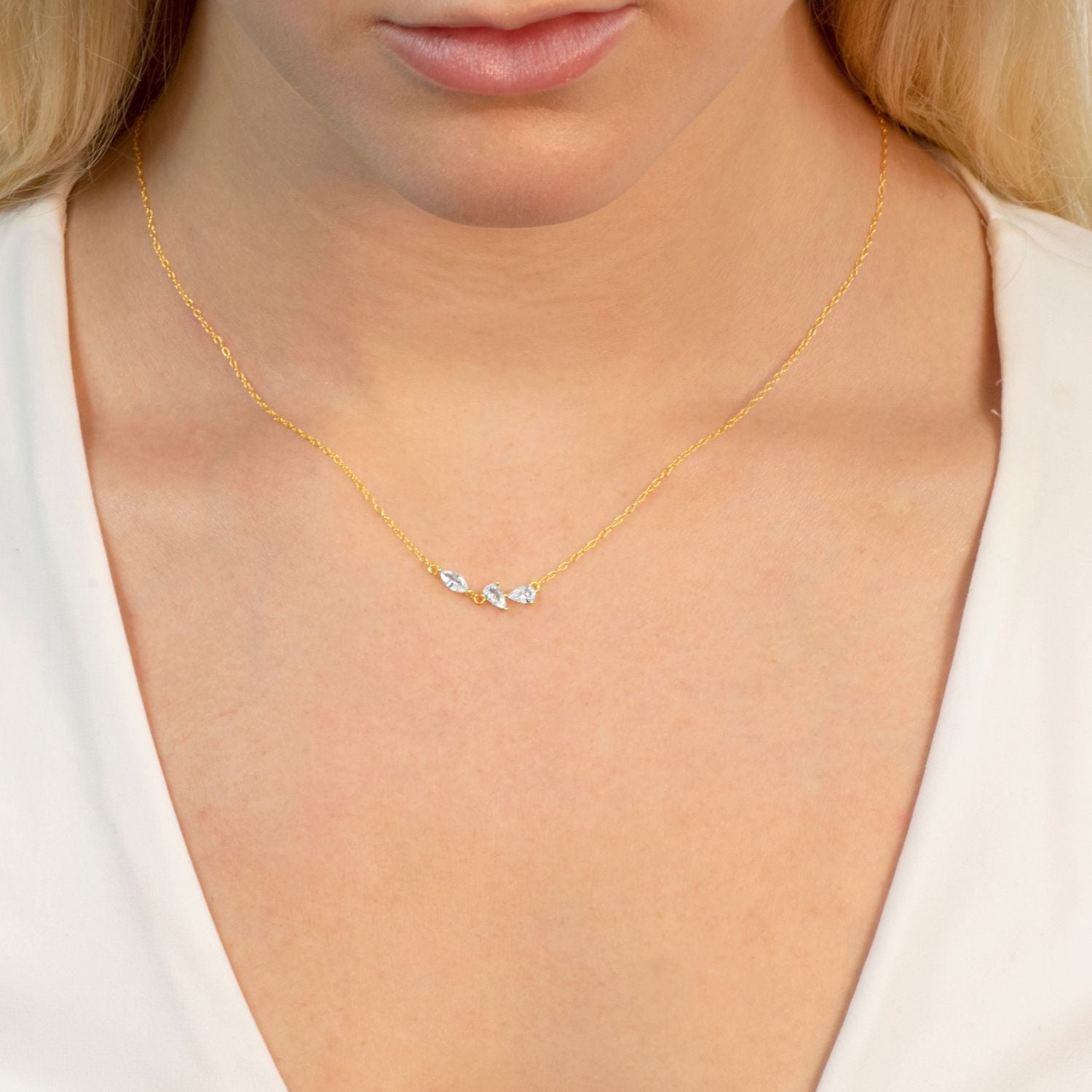 model wears gold 3petals necklace