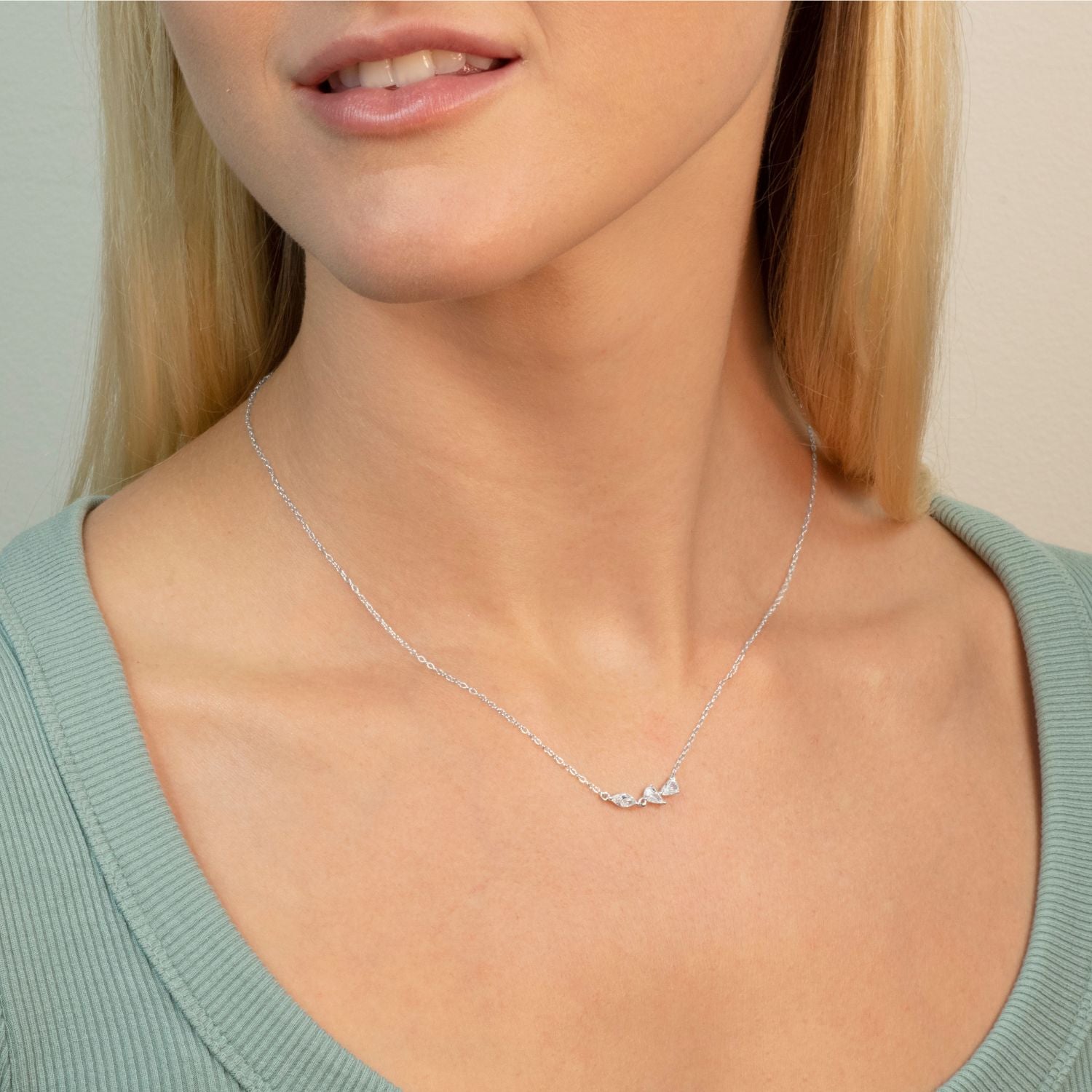 model wears silver 3petals necklace