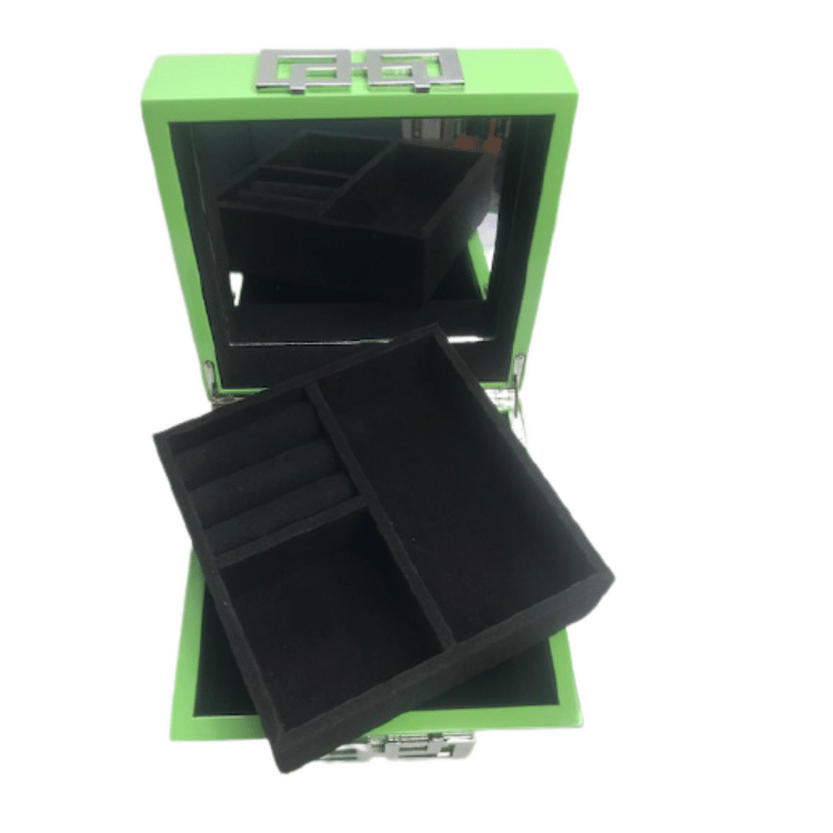 Green piano finish jewellery box open, revealing a soft-lined interior with compartments for rings, necklaces, and accessories