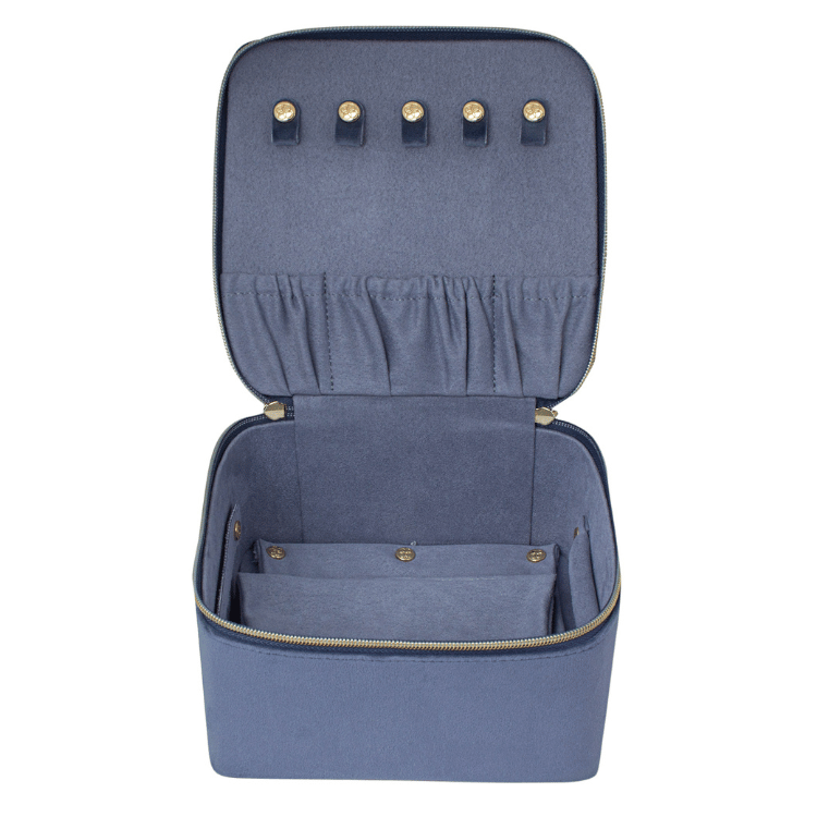 Open blue velvet jewellery box on a white background, revealing multiple compartments for organized jewellery storage.