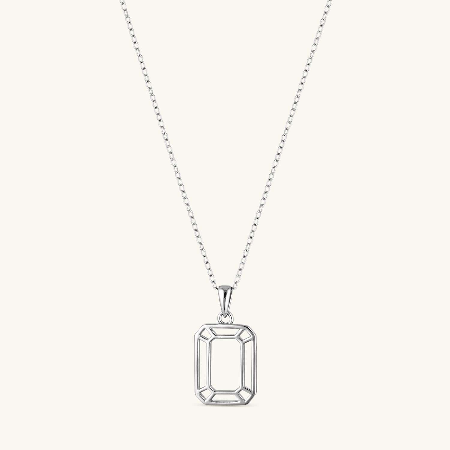 Interlocking box pendant necklace in silver featuring a modern geometric design on a delicate chain. Stylish, timeless, and versatile