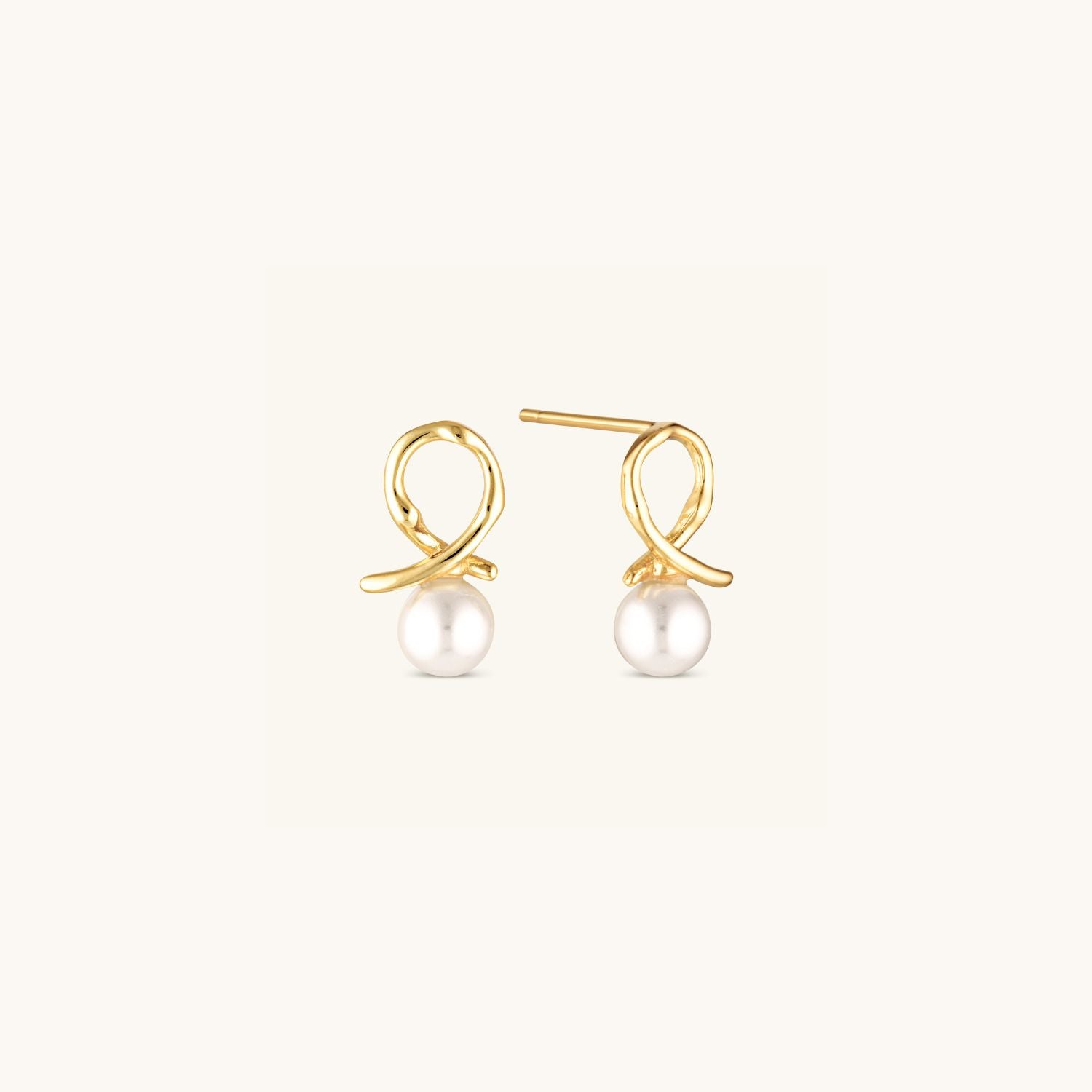Freshwater pearl stud earrings with a delicate gold loop, combining classic elegance with a modern touch for a timeless and sophisticated look