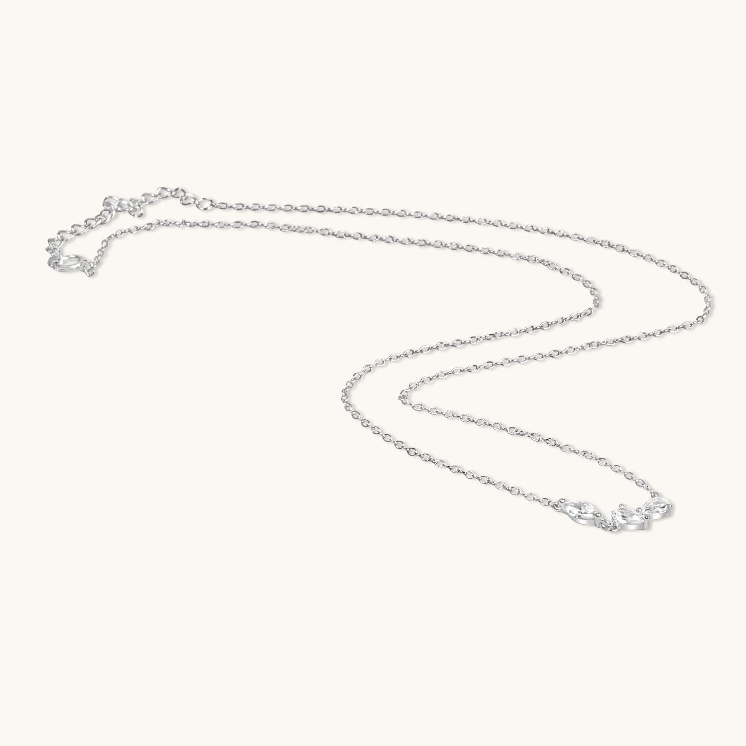 Silver cz 3 petals necklace flat lay
