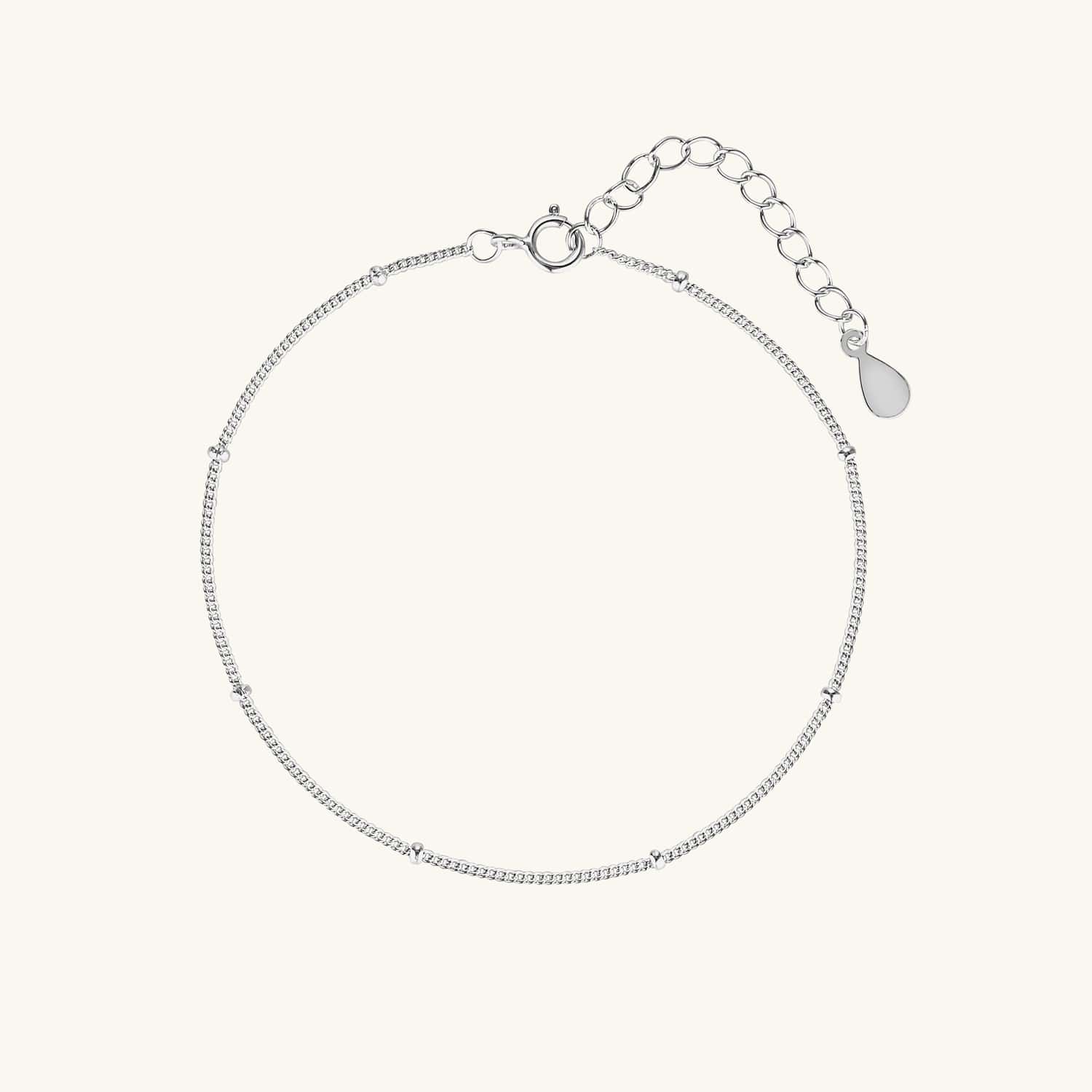 Sterling silver satellite chain bracelet with delicate beaded accents, perfect for layering or wearing alone for a minimalist, elegant look