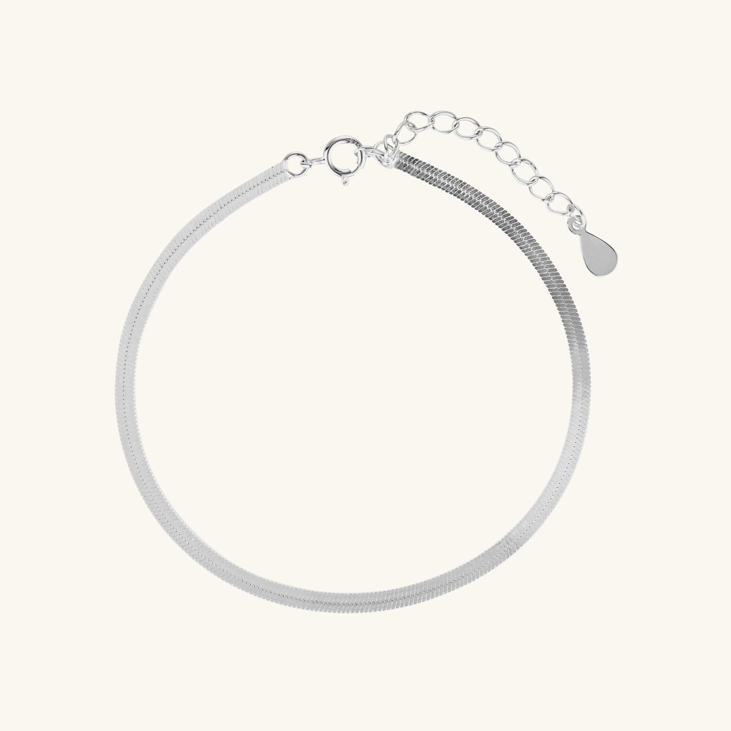 Sleek silver snake bracelet with a smooth, flat design and polished finish, adding a touch of modern elegance to any look.