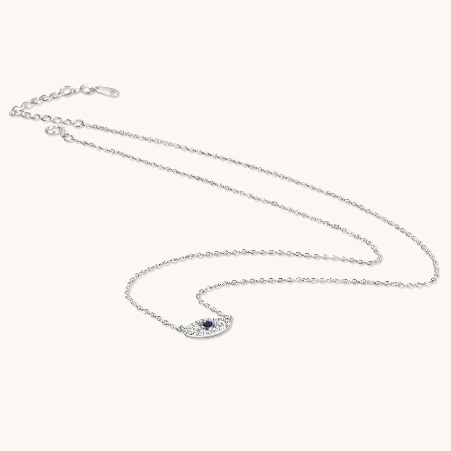 Elegant silver evil eye necklace with a sleek, minimalist charm on a delicate chain, offering timeless style and protective symbolism