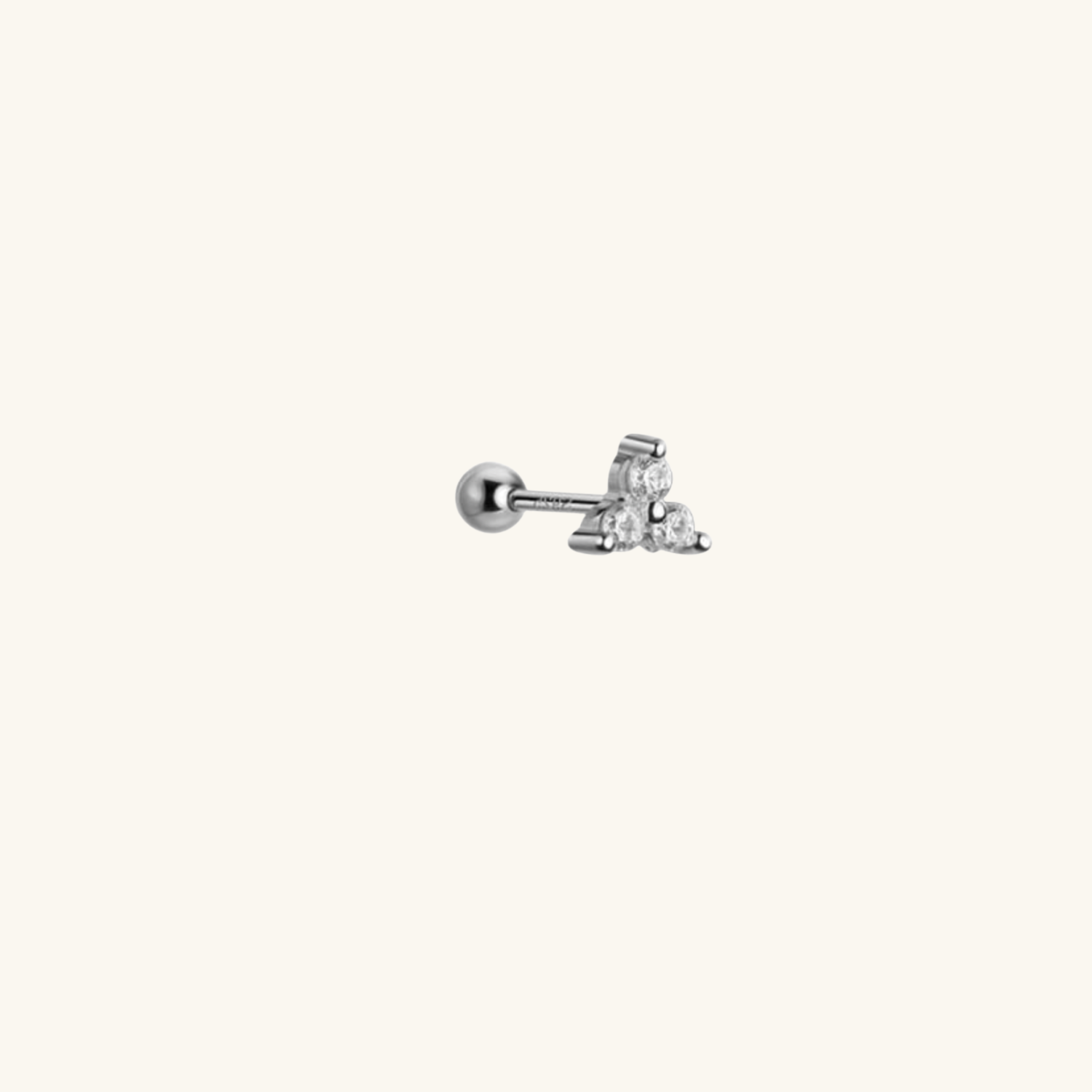 Single stud earring with a small cubic zirconia on a white background