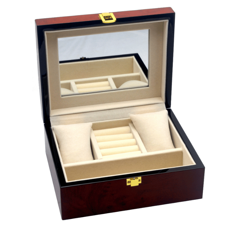 Wood finish jewellery box open on white background, showing soft lining, interior mirror, and organized storage compartments