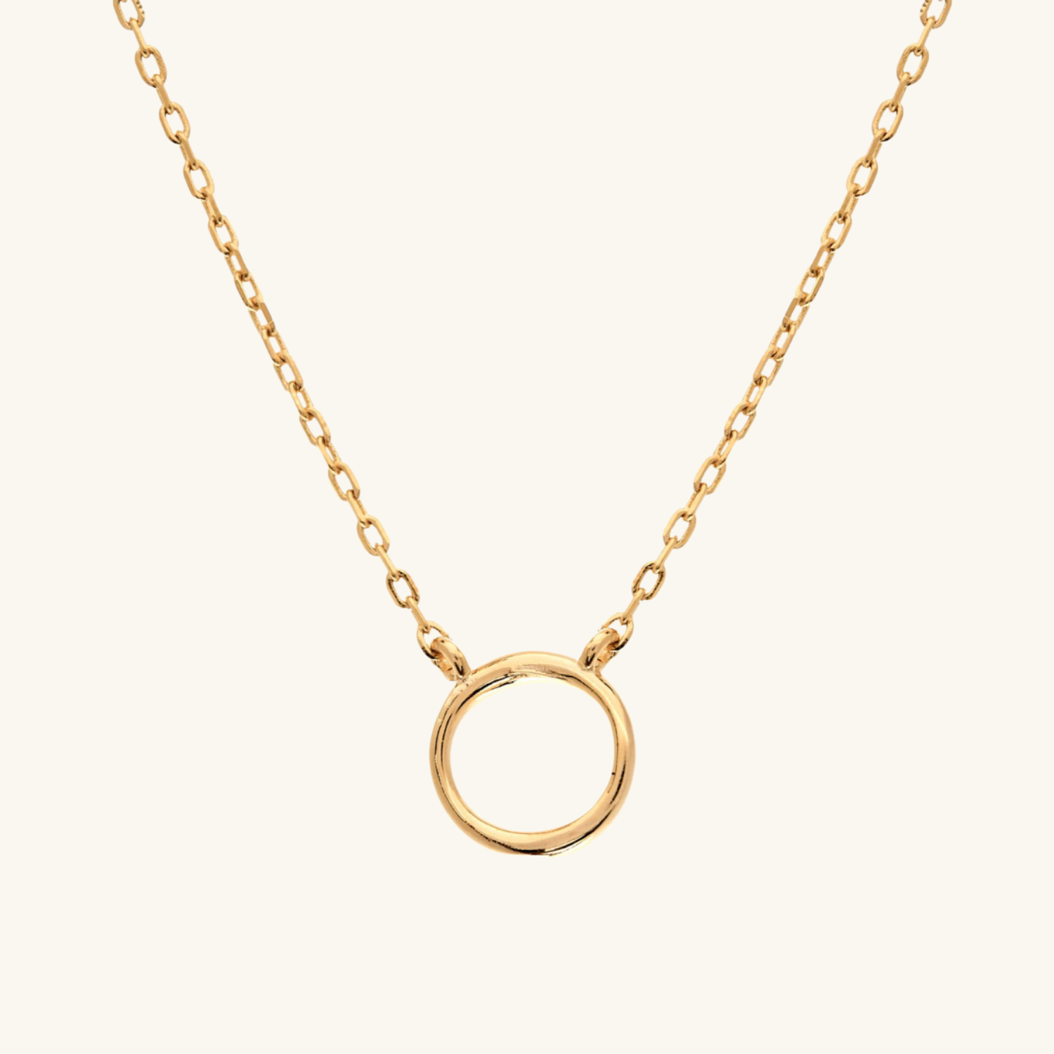 Circle Pendant necklace on cream background
