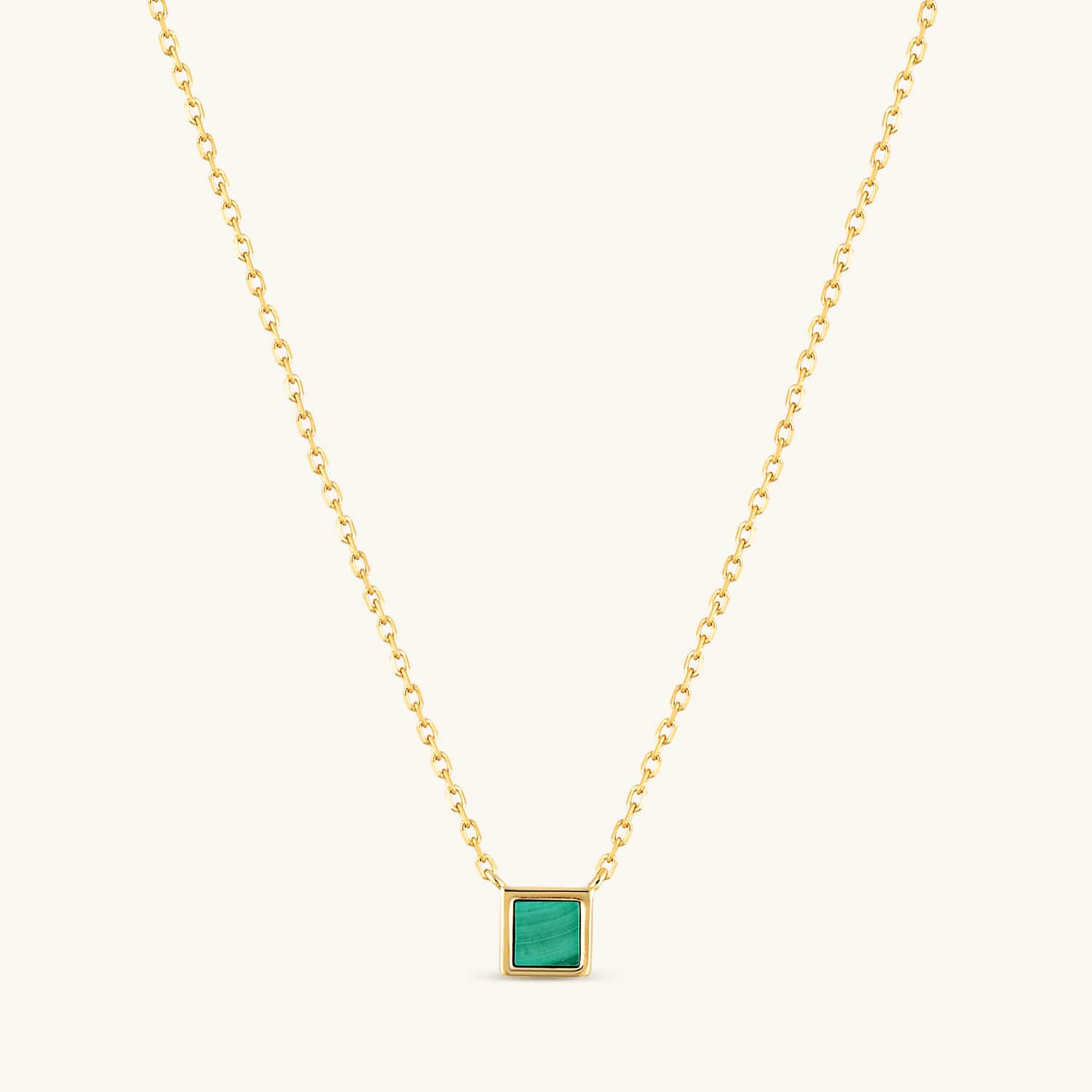 Malachite square pendant necklace on a gold chain, featuring rich green hues and timeless elegance. Hypoallergenic and lead-free