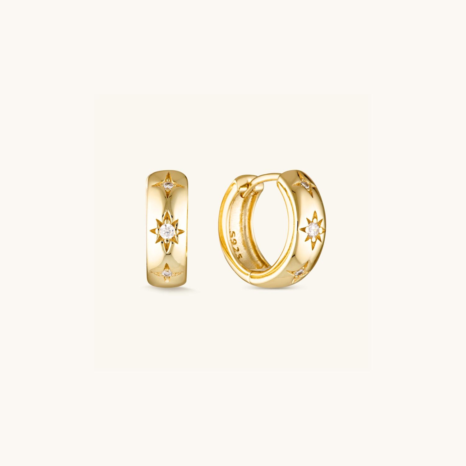 Stargazer Huggie Earrings with a thick band and cubic zirconia stars in sterling silver or gold-plated, inspired by the beauty of the night sky