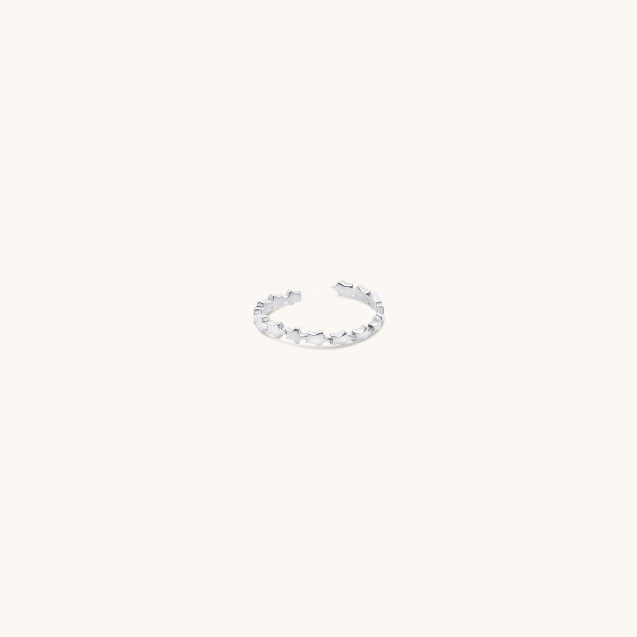 Sterling silver adjustable toe ring featuring linked star design