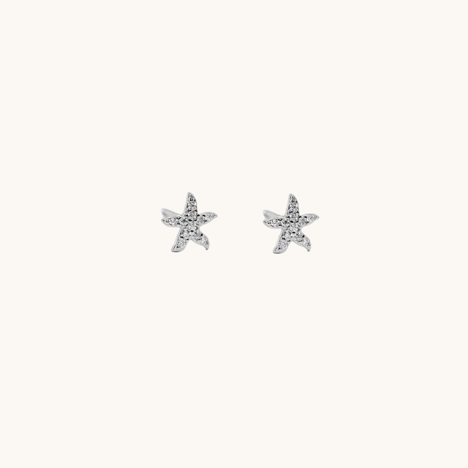 Star fish stud earrings on an of white background