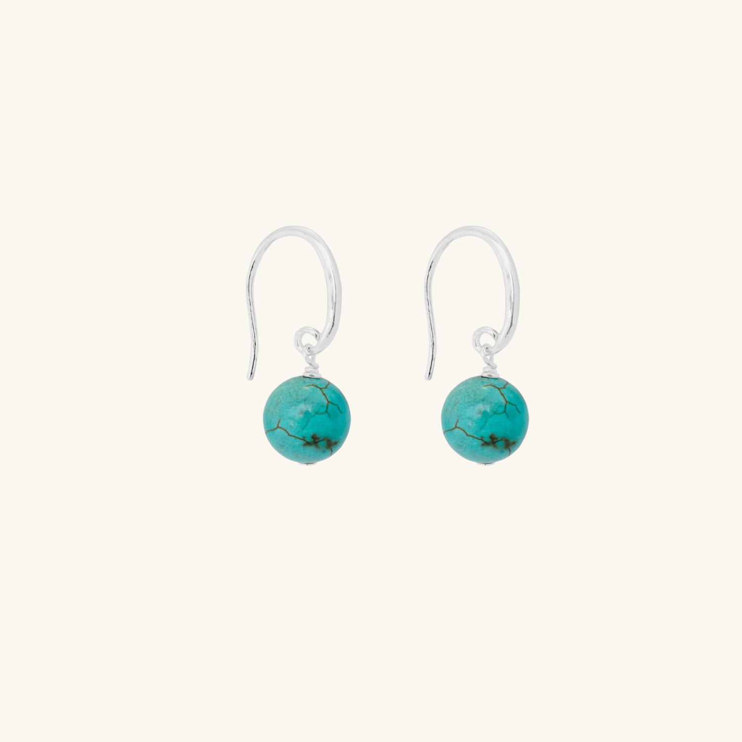 Turquoise earrings on a white background