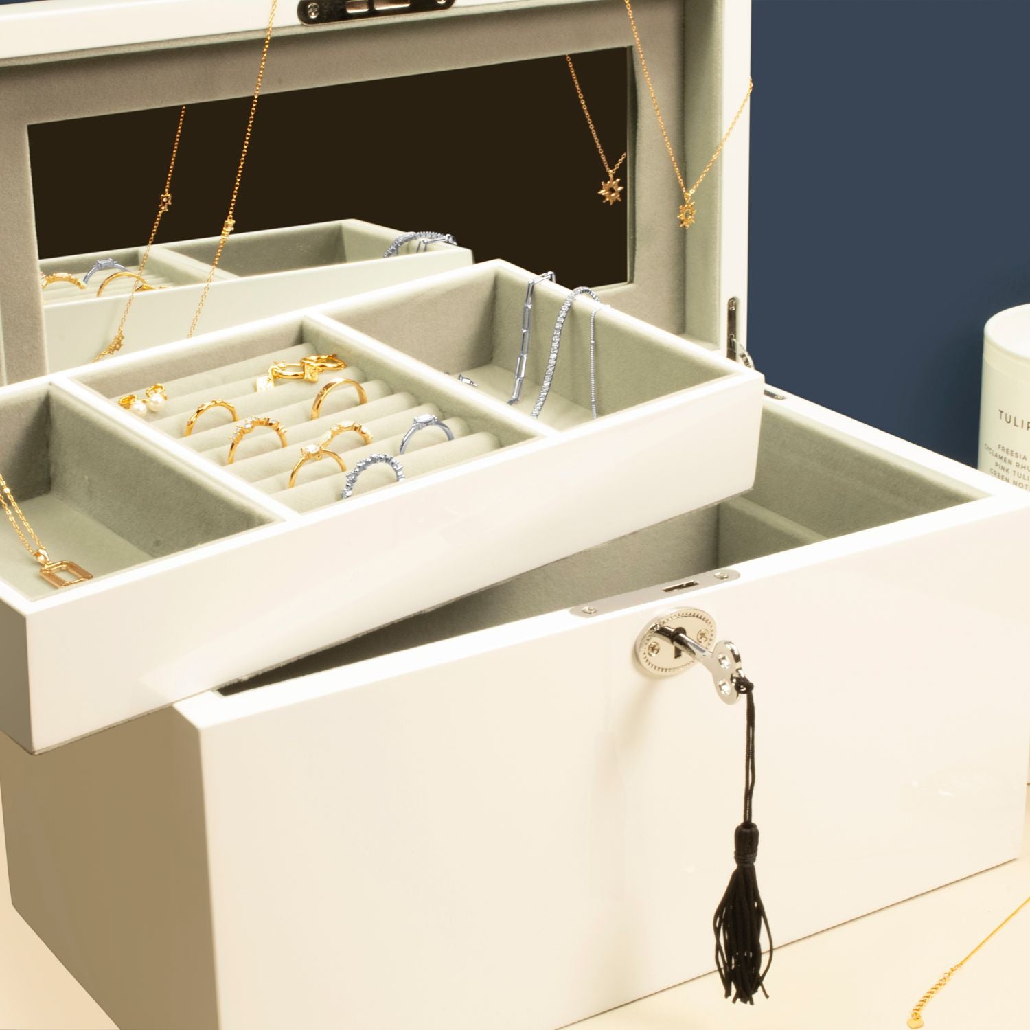 Lifestyle image of large Kandi Jewellery Box in white, open with jewellery inside, showcasing organized storage and elegant design