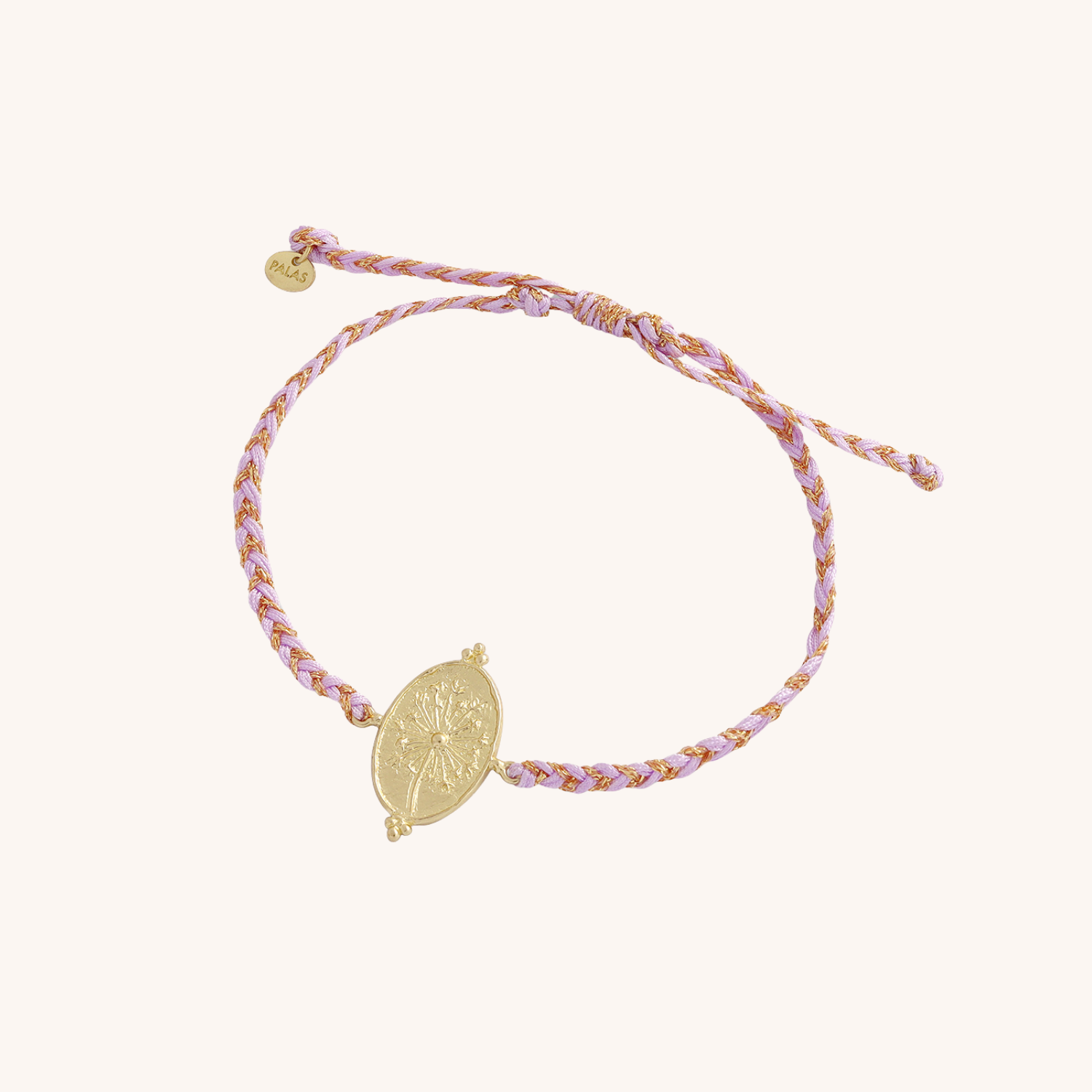 Bracelet with braided design and gold charm on a white background