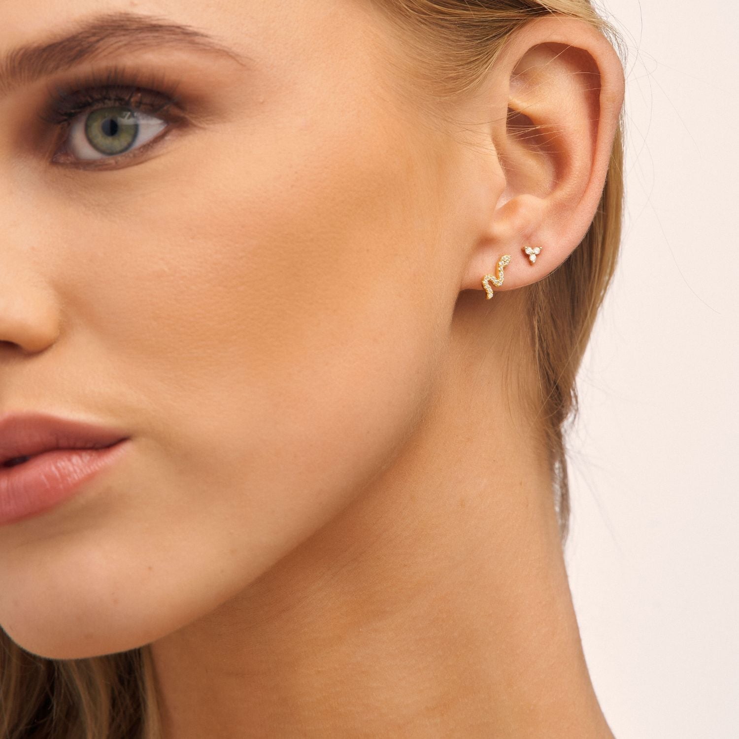 Model showcasing lotus cubic zirconia earrings, featuring intricate floral details and a timeless shimmer for a refined look