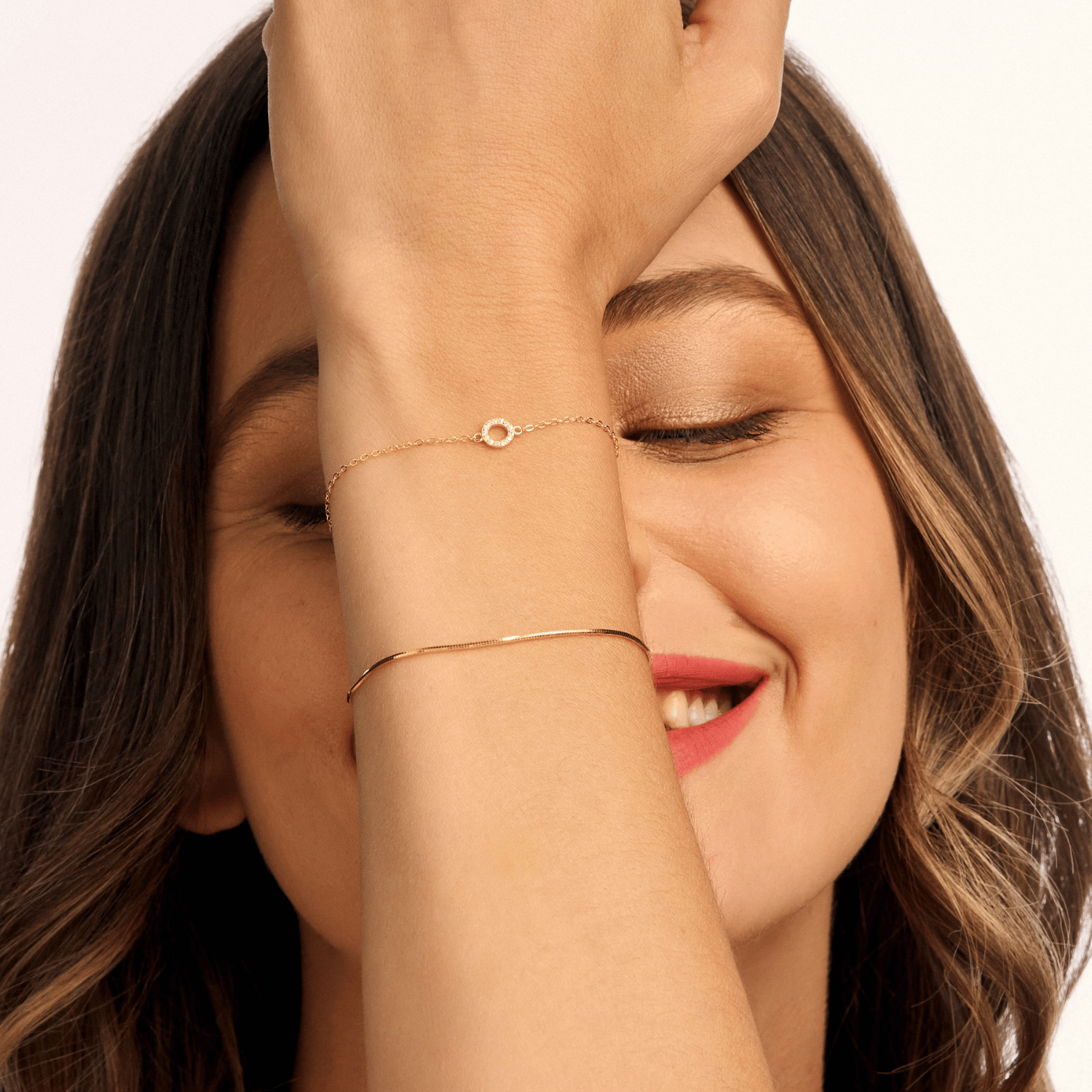 Model wearing a gold cubic zirconia circle bracelet, showcasing its delicate sparkle and elegant design. A perfect accessory for any occasion