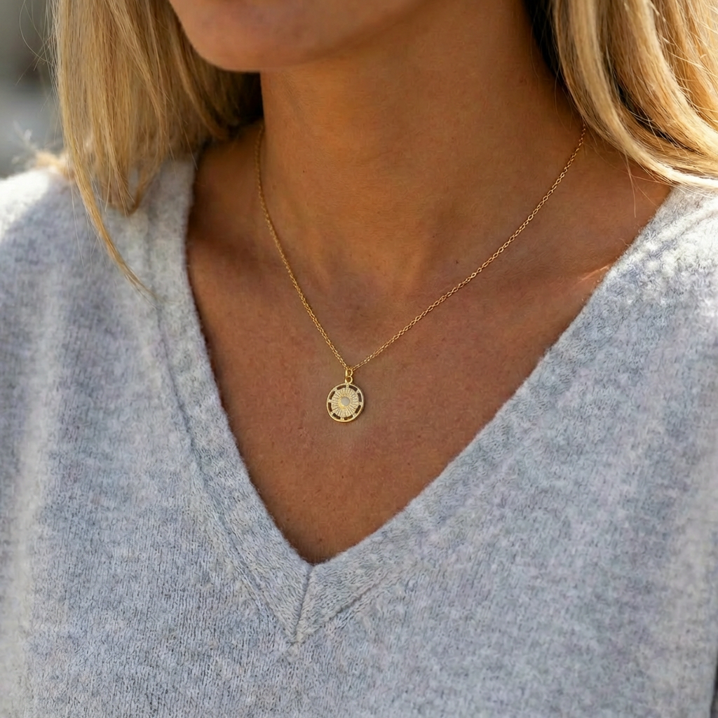 model wearing sun coin necklace in grey sweater