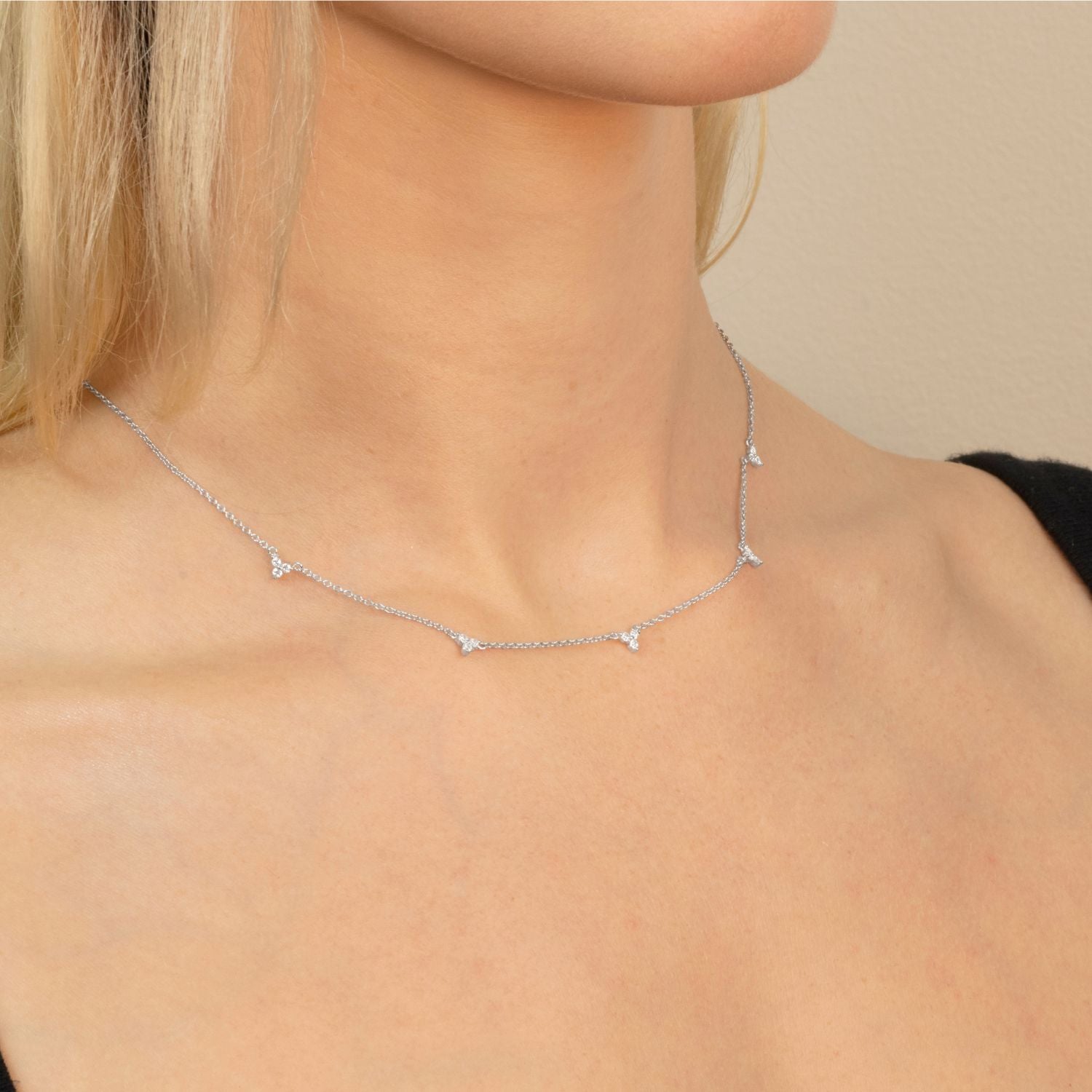 model wears lotus silver necklace