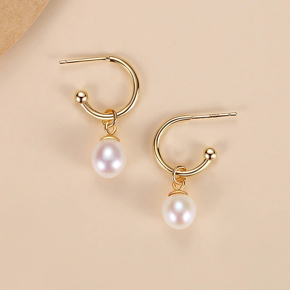 Classic gold freshwater pearl drop earrings with a refined design, adding effortless elegance and a touch of luxury to any outfit