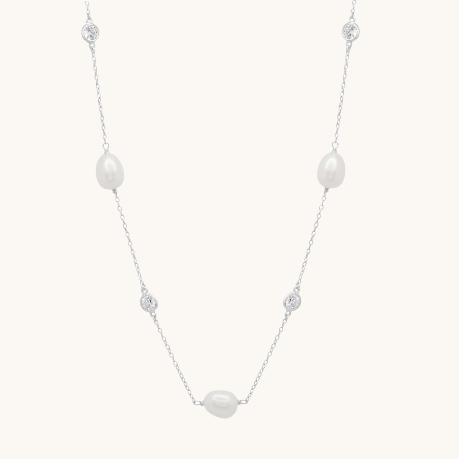 Sterling Silver necklace with Pearl and Cubic Zirconia along its length. Necklace measures 92cm.
