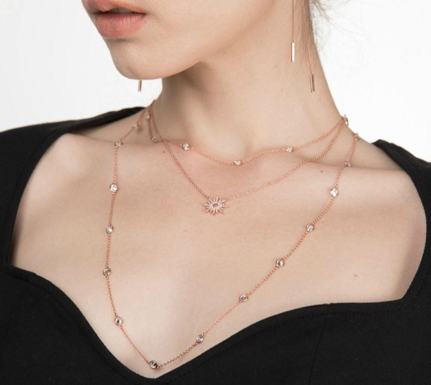 Model wearing gold plated Sunburst necklace stacked with others from the I Dream of Silver Collection