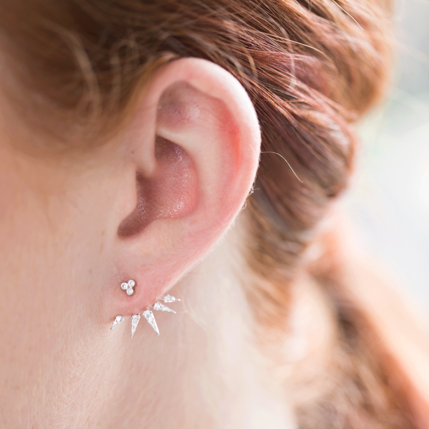 Red haired model wearing Cubic Zirconia Earrings Featuring Decorative Cuff