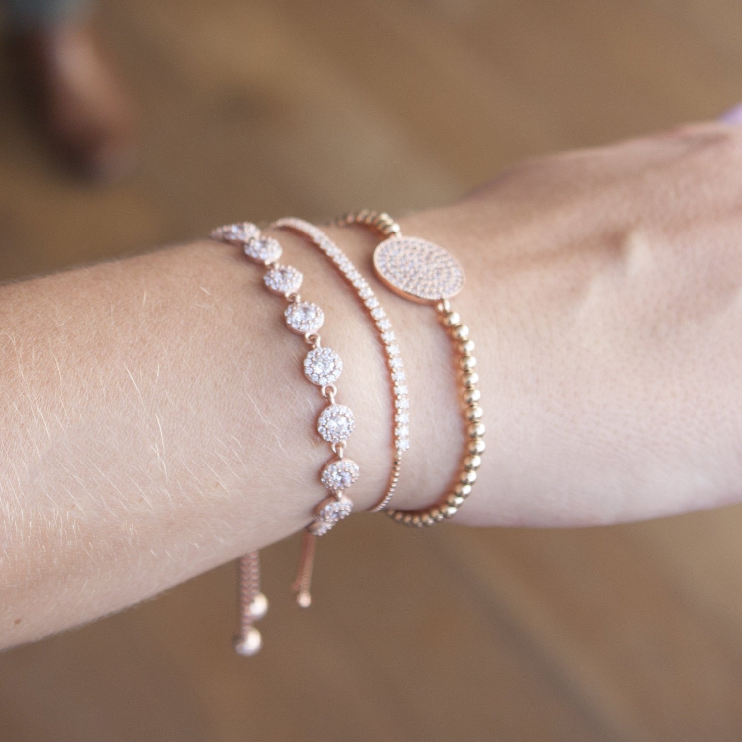 Model wears pave beaded bracelet with swarovski crystals, stacked with two other bracelets from the I Dream of Silver collection
