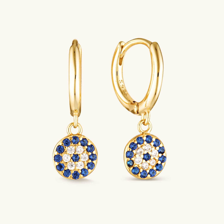 Blue pavé drop huggie earrings featuring shimmering blue stones on a sleek hoop. A bold yet elegant accessory perfect for adding a pop of color