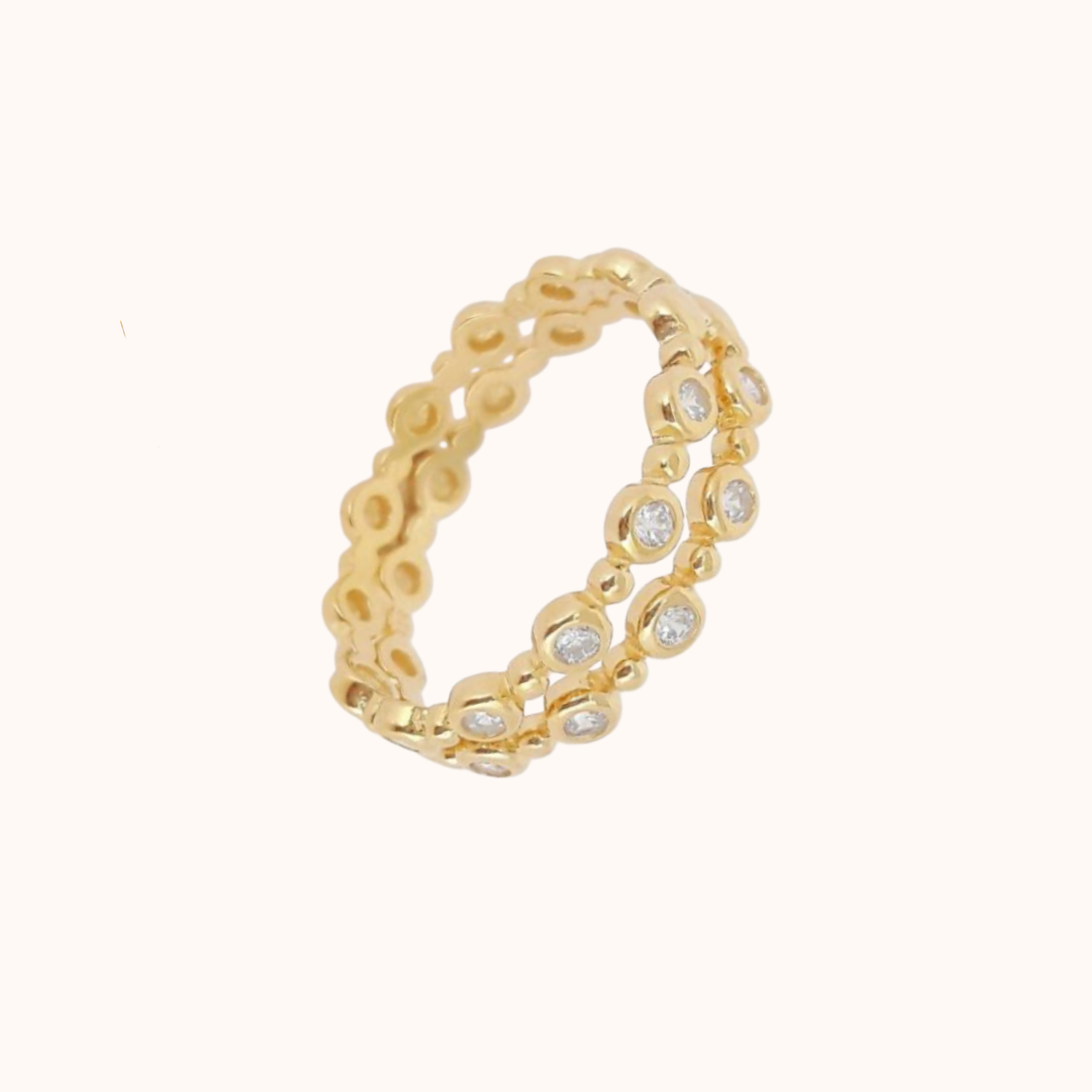 Gold ring with embedded cz on a white background