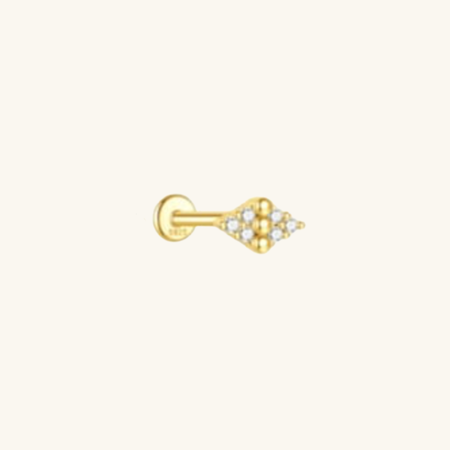 Gold single earring with small cubic zirconia on a white background