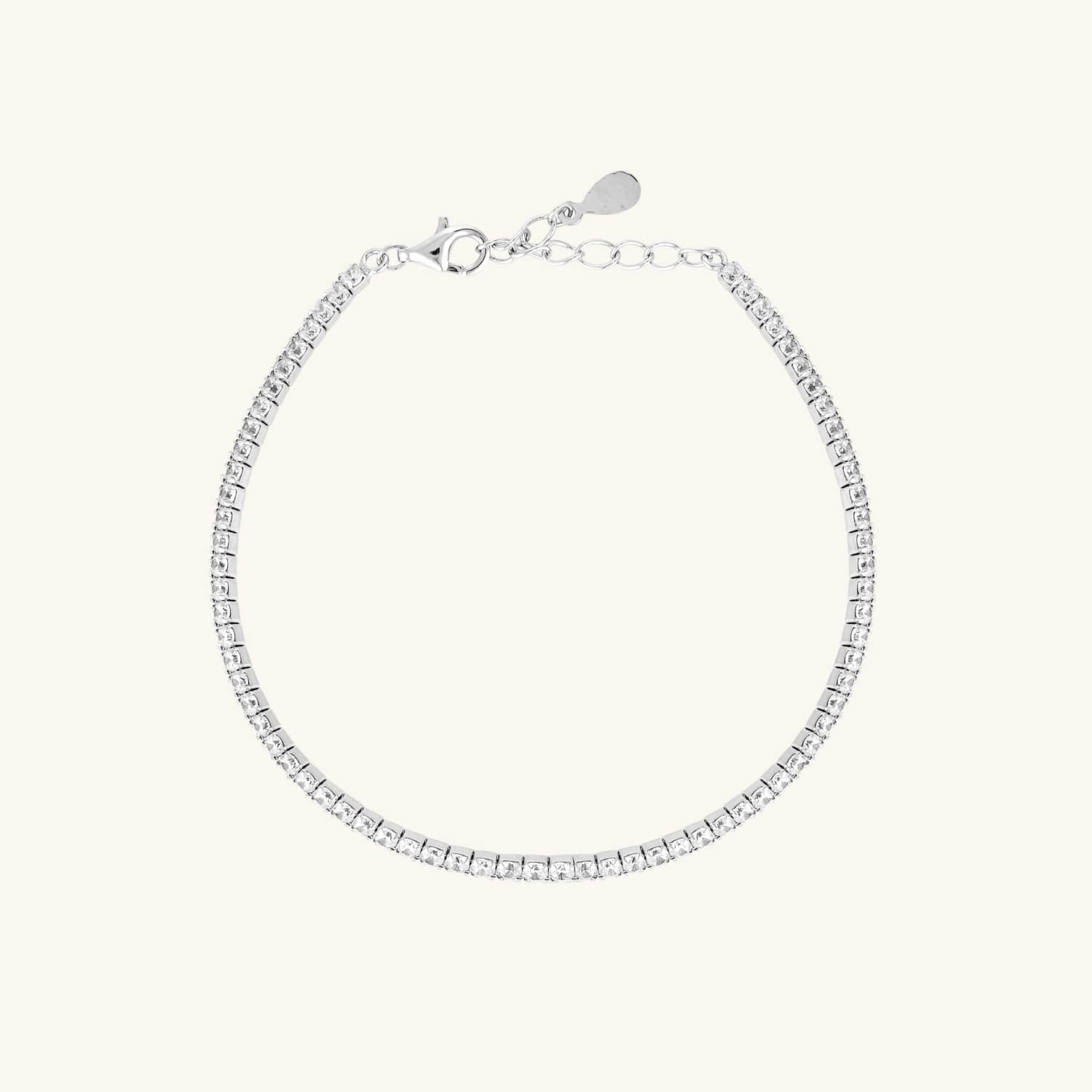 Sterling silver cubic zirconia tennis bracelet featuring a classic row of shimmering stones, adding timeless elegance and sparkle to any look