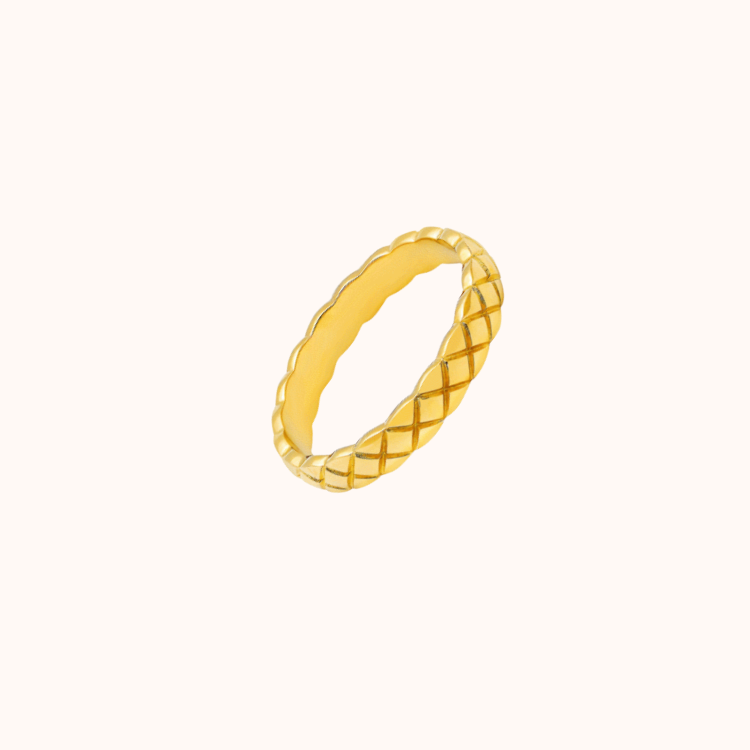 Criss cross patterned ring on cream background